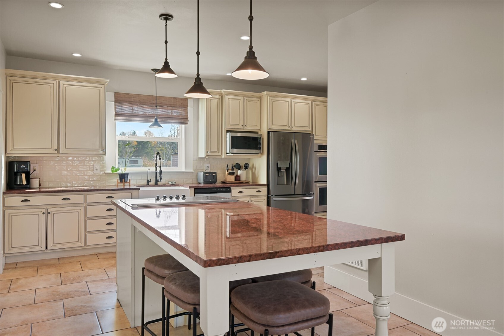2880 Creasey Road Custer, WA 98240 - Photo 6 of 40 a kitchen with kitchen island granite countertop a sink a counter space appliances and cabinets