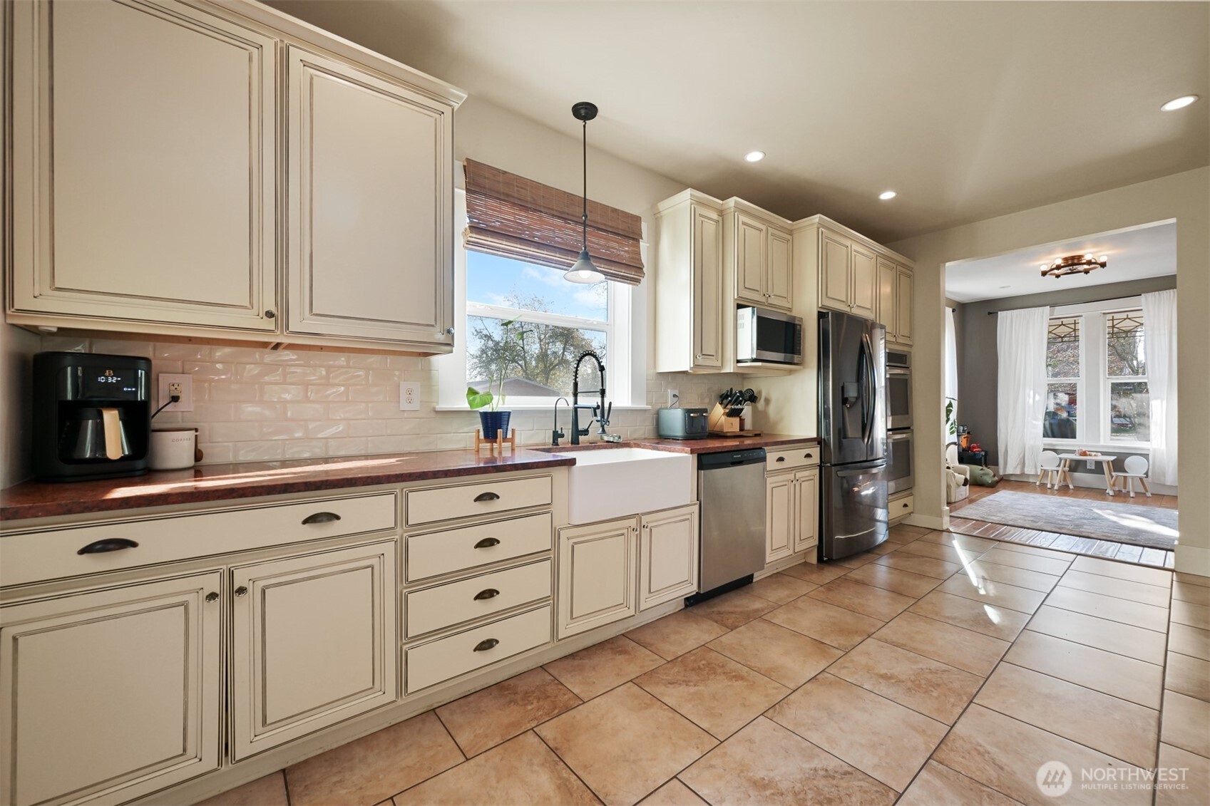 2880 Creasey Road Custer, WA 98240 - Photo 7 of 40 a kitchen with white cabinets and white appliances