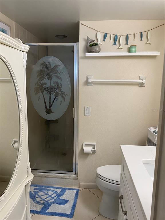 4453 South Atlantic Avenue, Unit 208 Ponce Inlet, FL 32127 - Photo 28 of 40 a bathroom with a toilet and a shower