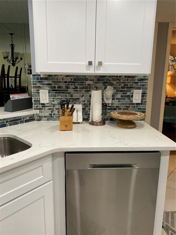 4453 South Atlantic Avenue, Unit 208 Ponce Inlet, FL 32127 - Photo 36 of 40 a kitchen with a sink and a white cabinets