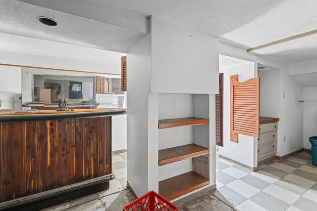 a kitchen with a sink and cabinets