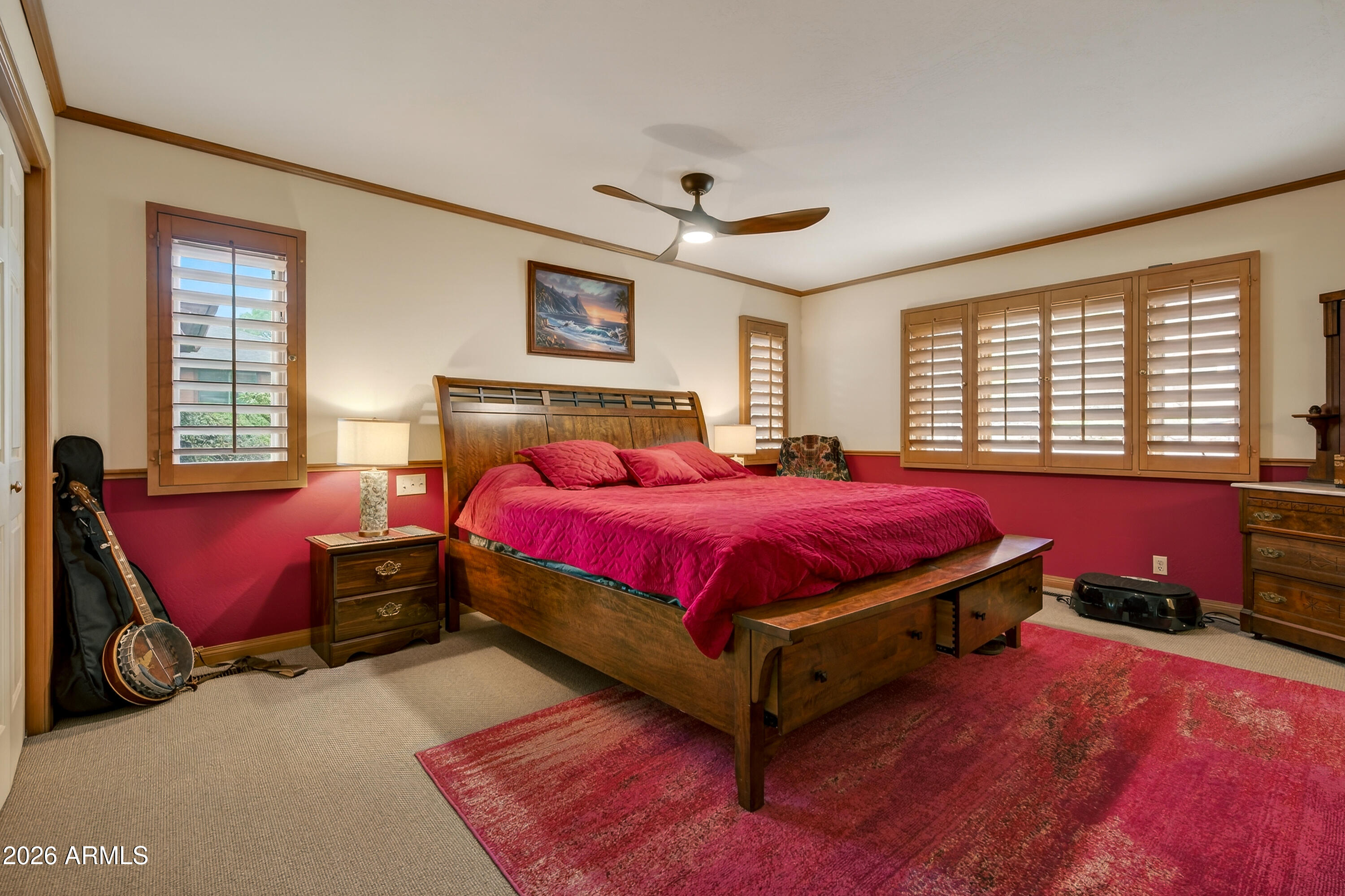 2215 Lariat Road Sedona, AZ 86336 - Photo 23 of 45 a spacious bedroom with a bed and wooden floor