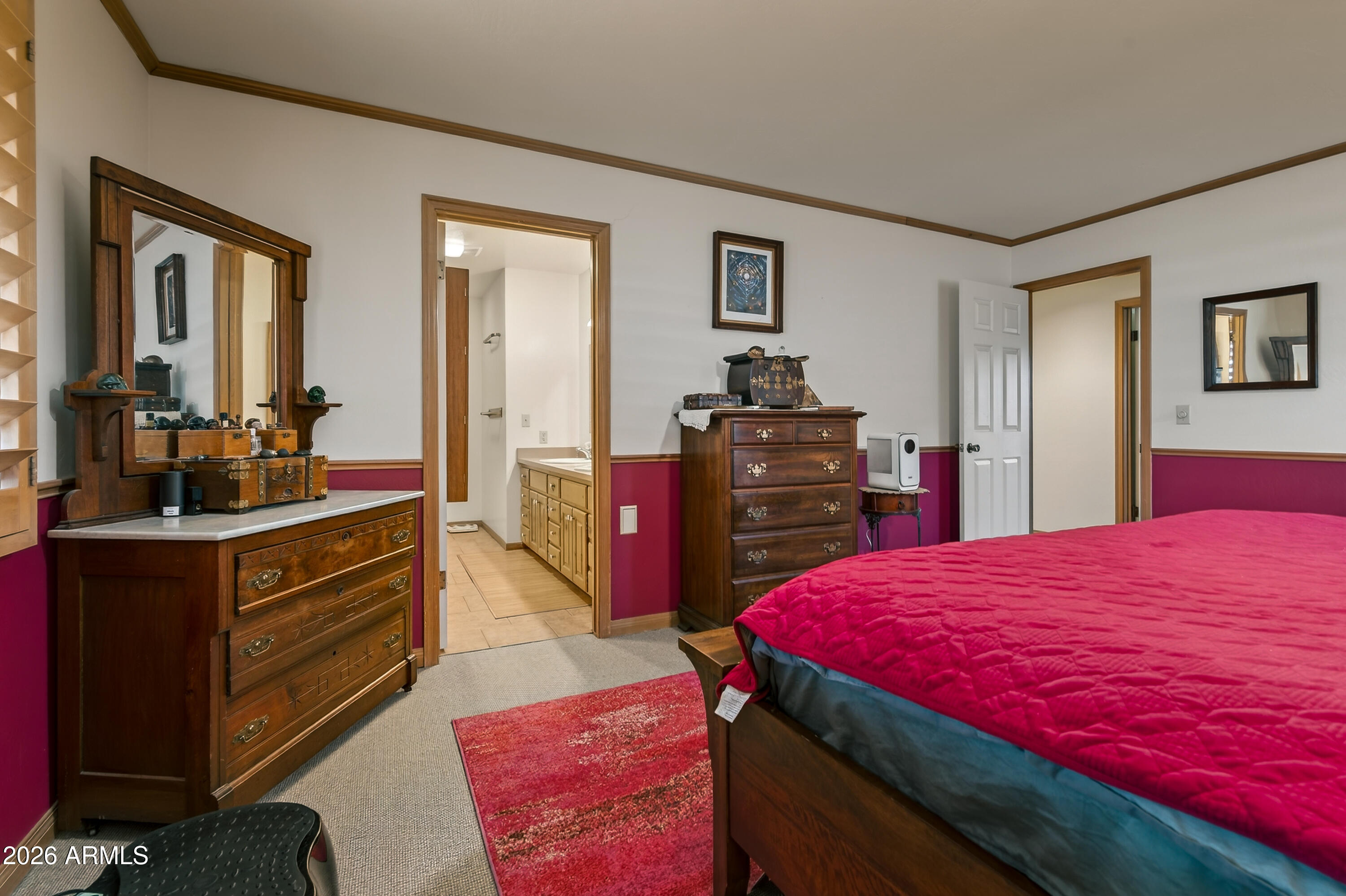 2215 Lariat Road Sedona, AZ 86336 - Photo 24 of 45 a bed room with a bed and a dresser