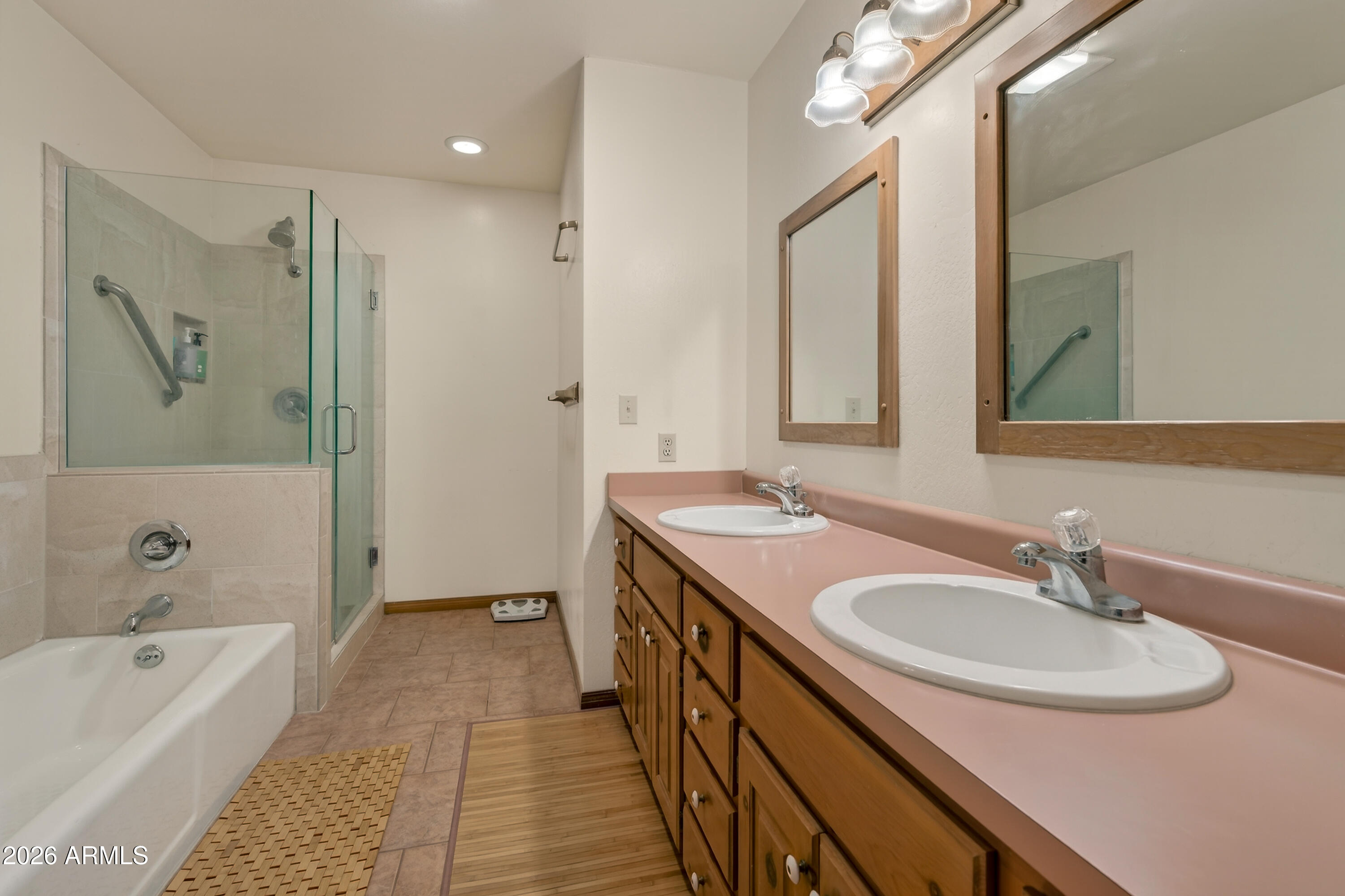 2215 Lariat Road Sedona, AZ 86336 - Photo 25 of 45 a bathroom with a tub sink and mirror