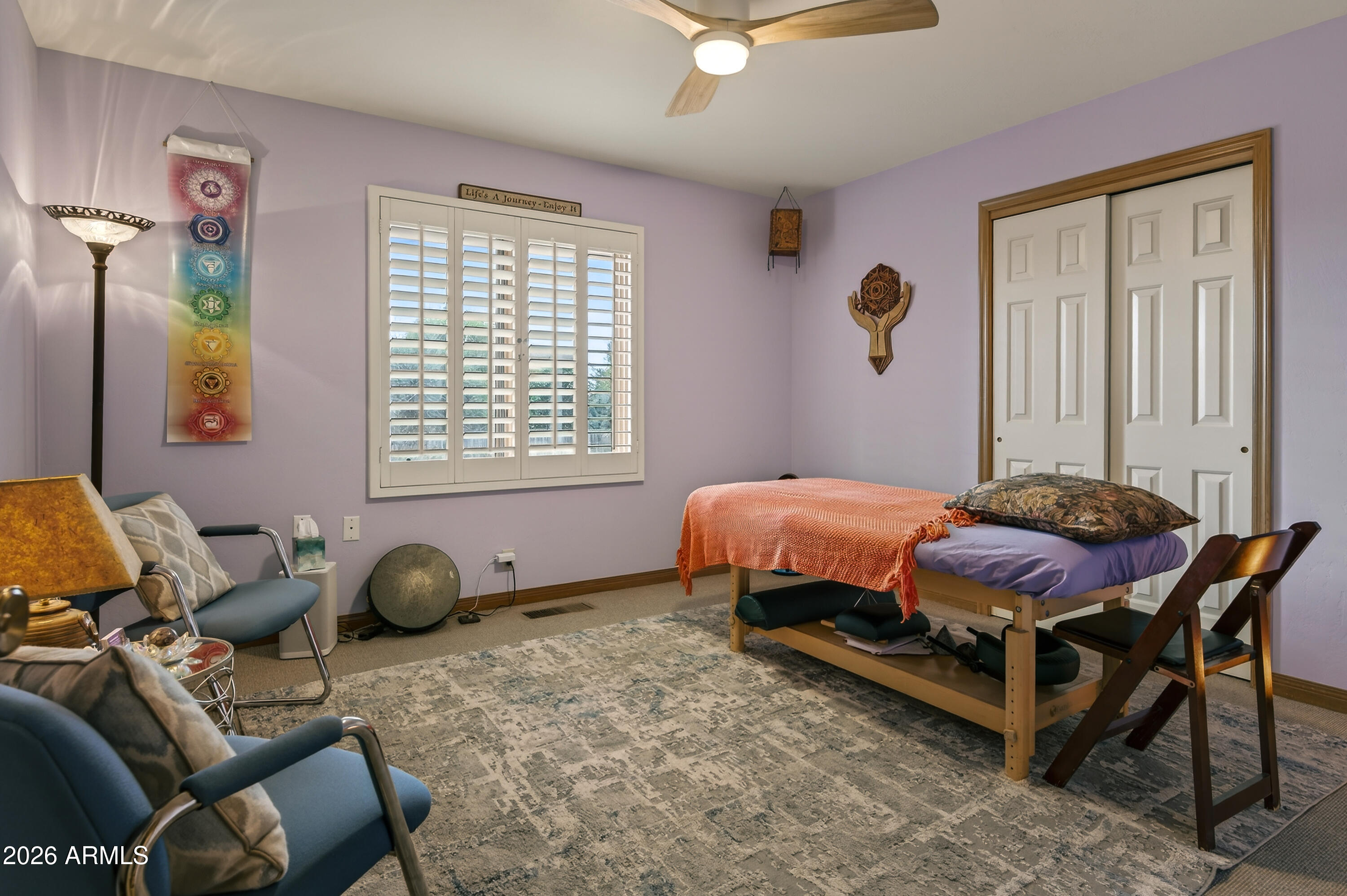 2215 Lariat Road Sedona, AZ 86336 - Photo 27 of 45 a bedroom with a bed and a window