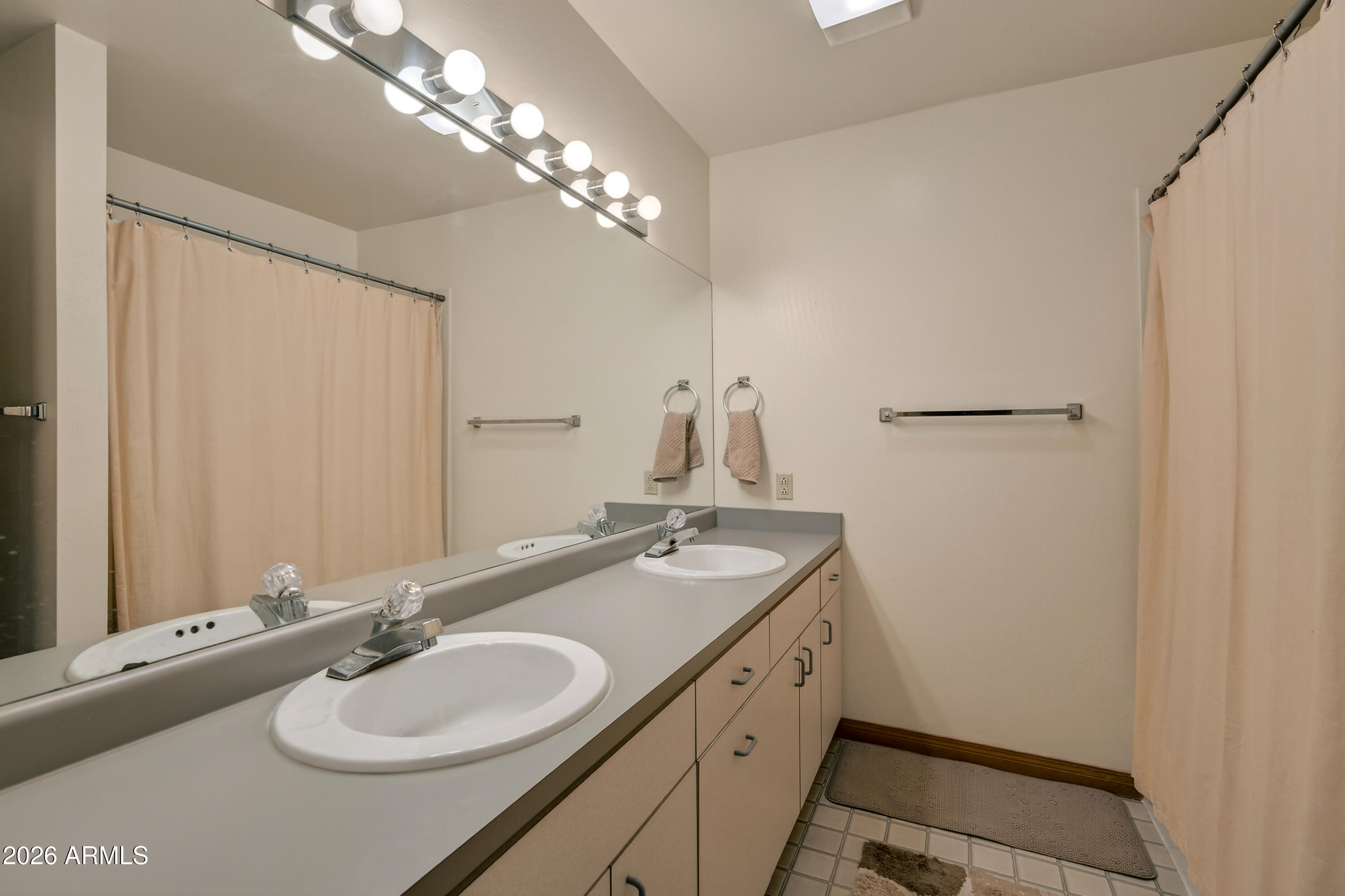 2215 Lariat Road Sedona, AZ 86336 - Photo 28 of 45 a bathroom with a sink double vanity and a mirror