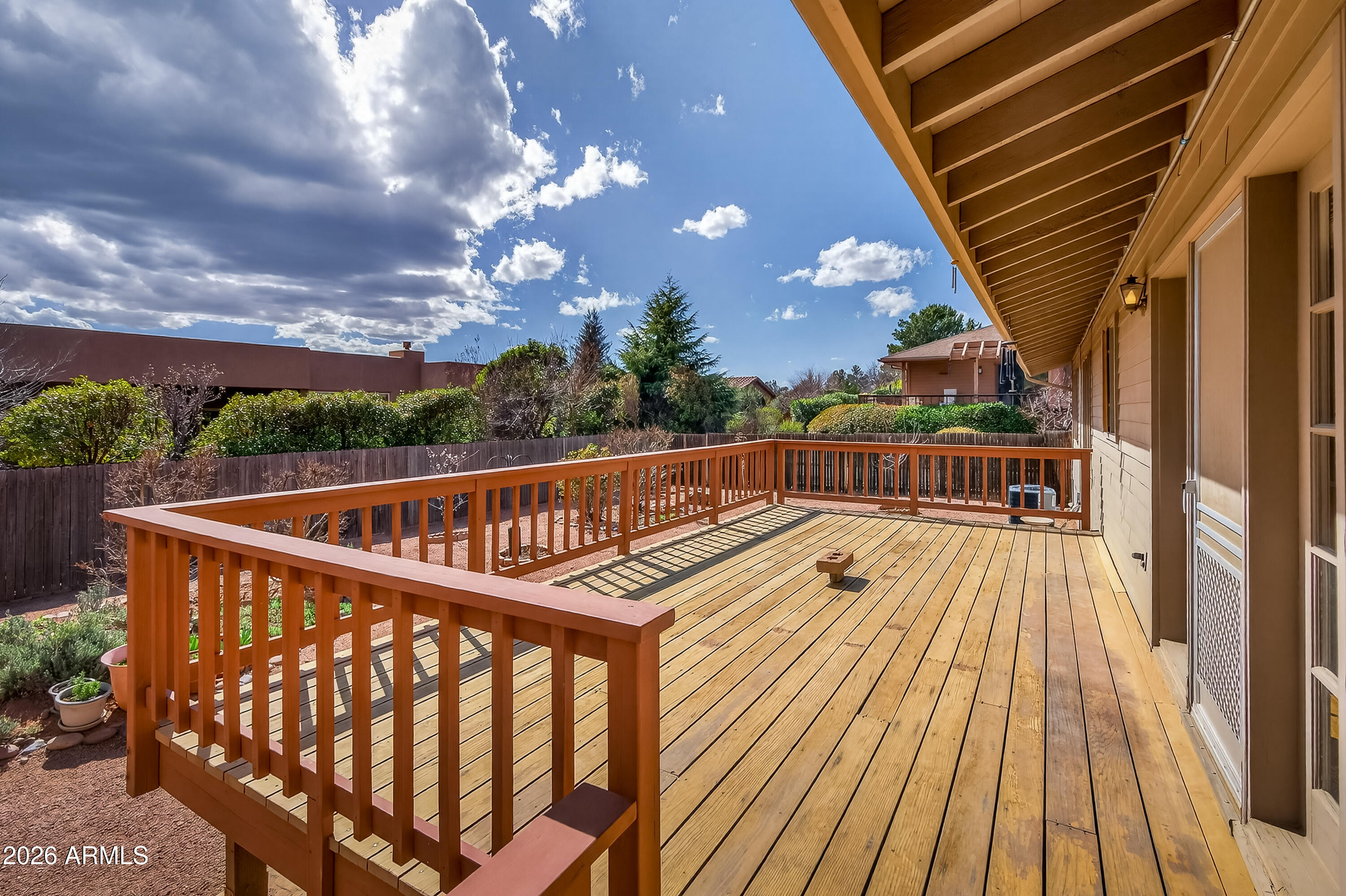 2215 Lariat Road Sedona, AZ 86336 - Photo 33 of 45 a view of balcony with wooden floor and fence