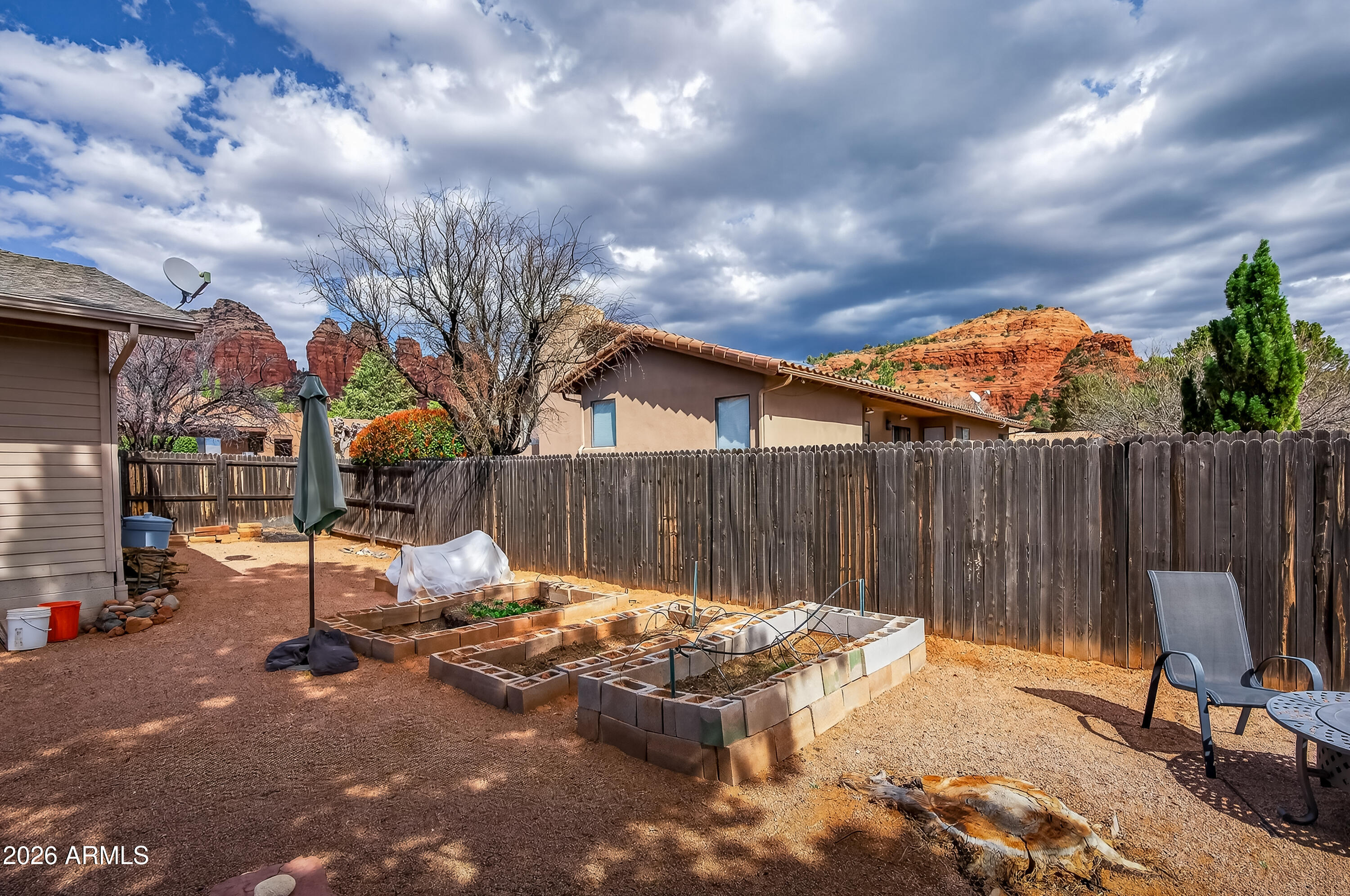 2215 Lariat Road Sedona, AZ 86336 - Photo 34 of 45 a view of backyard with wooden fence