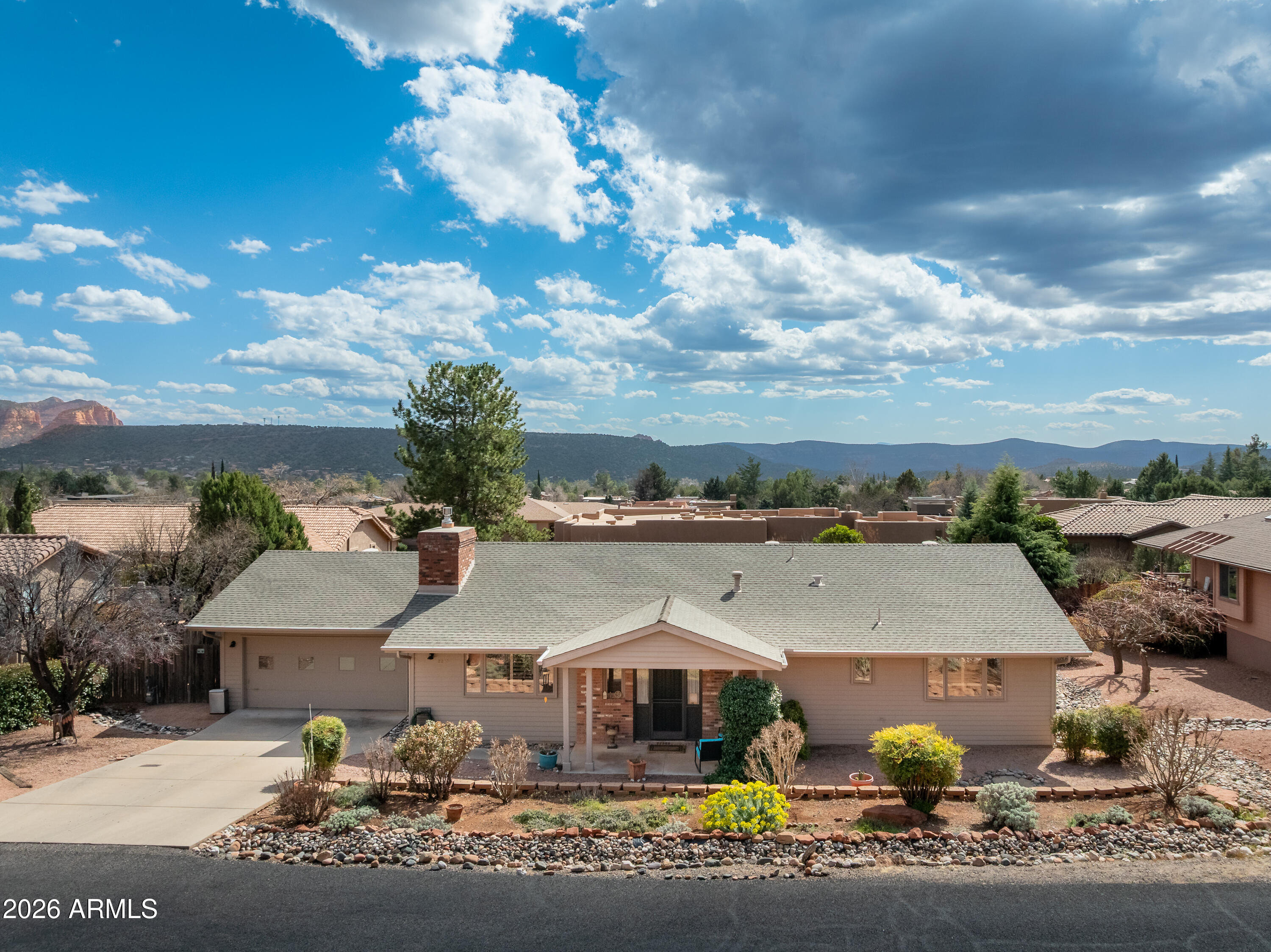 2215 Lariat Road Sedona, AZ 86336 - Photo 4 of 45 front view of house with a swimming pool