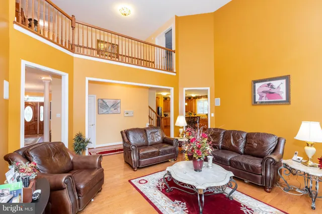 a living room with furniture a table and a potted plant