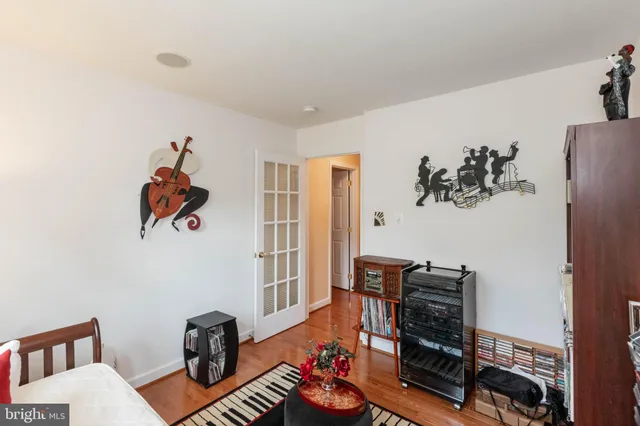 a living room with furniture a rug and a window