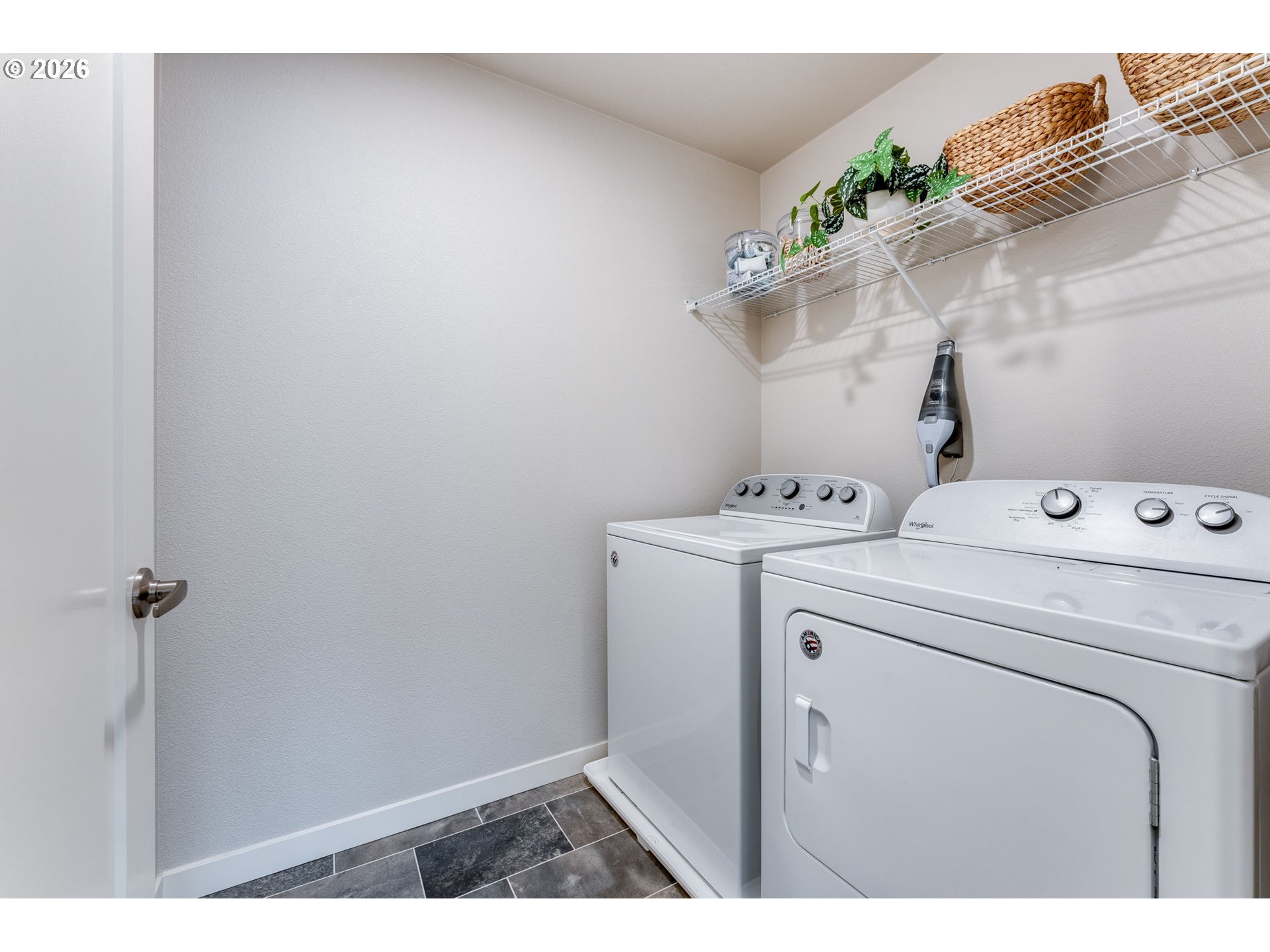 17149 Southwest Snowdale Street, Unit 103 Beaverton, OR 97007 - Photo 21 of 48 a utility room with dryer and washer