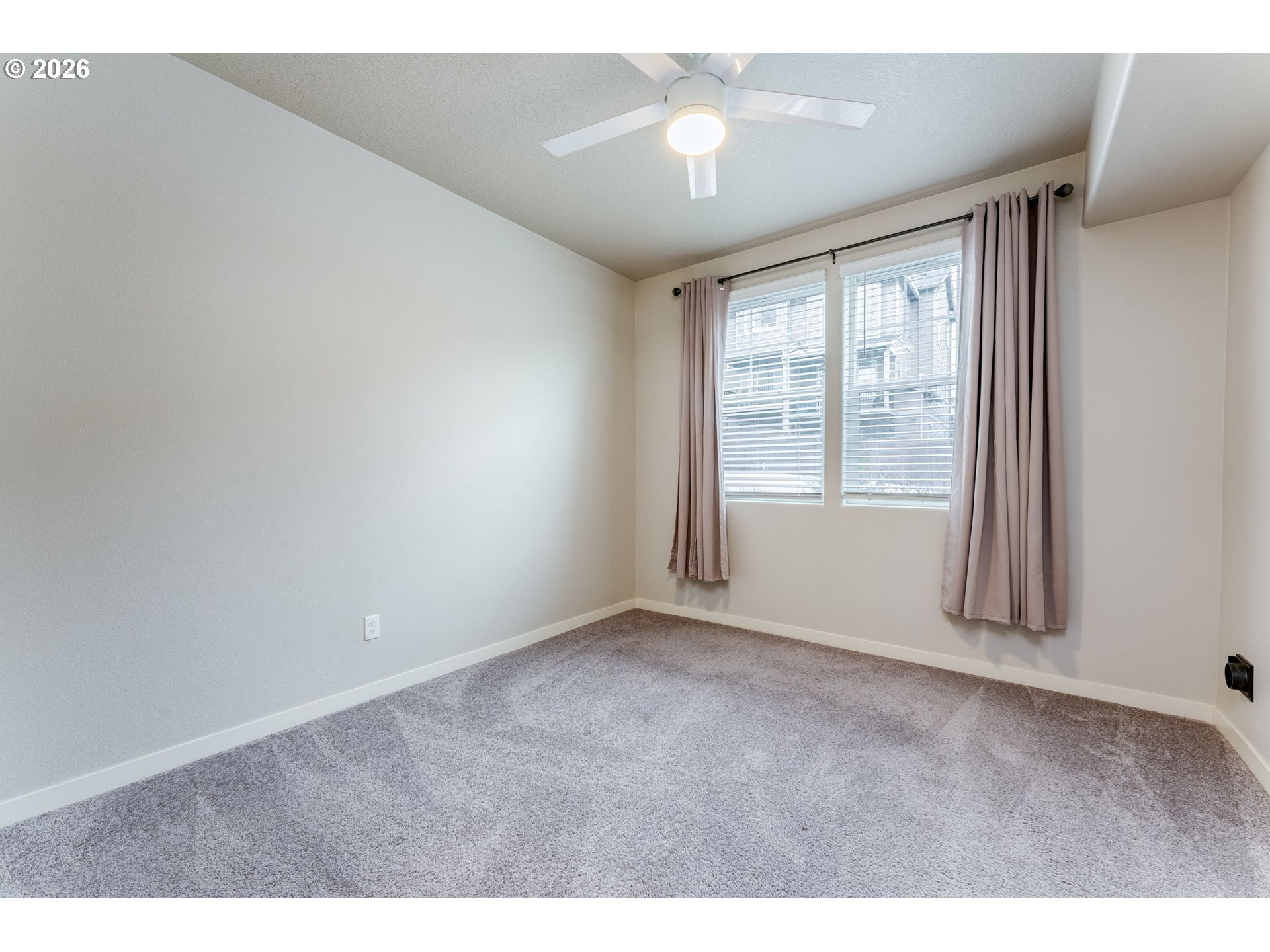 17149 Southwest Snowdale Street, Unit 103 Beaverton, OR 97007 - Photo 24 of 48 a view of an empty room with a window