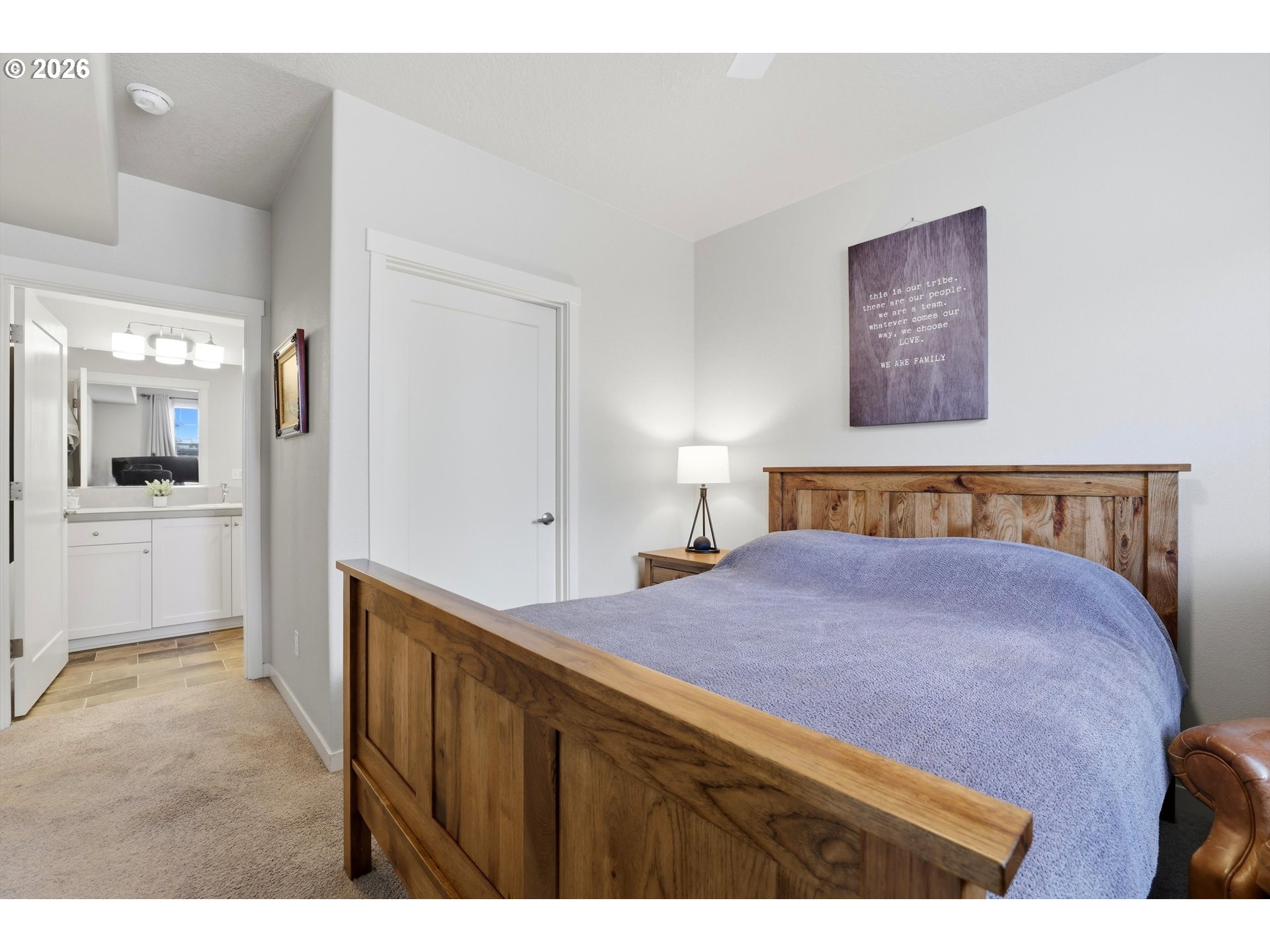17149 Southwest Snowdale Street, Unit 103 Beaverton, OR 97007 - Photo 25 of 48 a bedroom with a bed and a view of kitchen