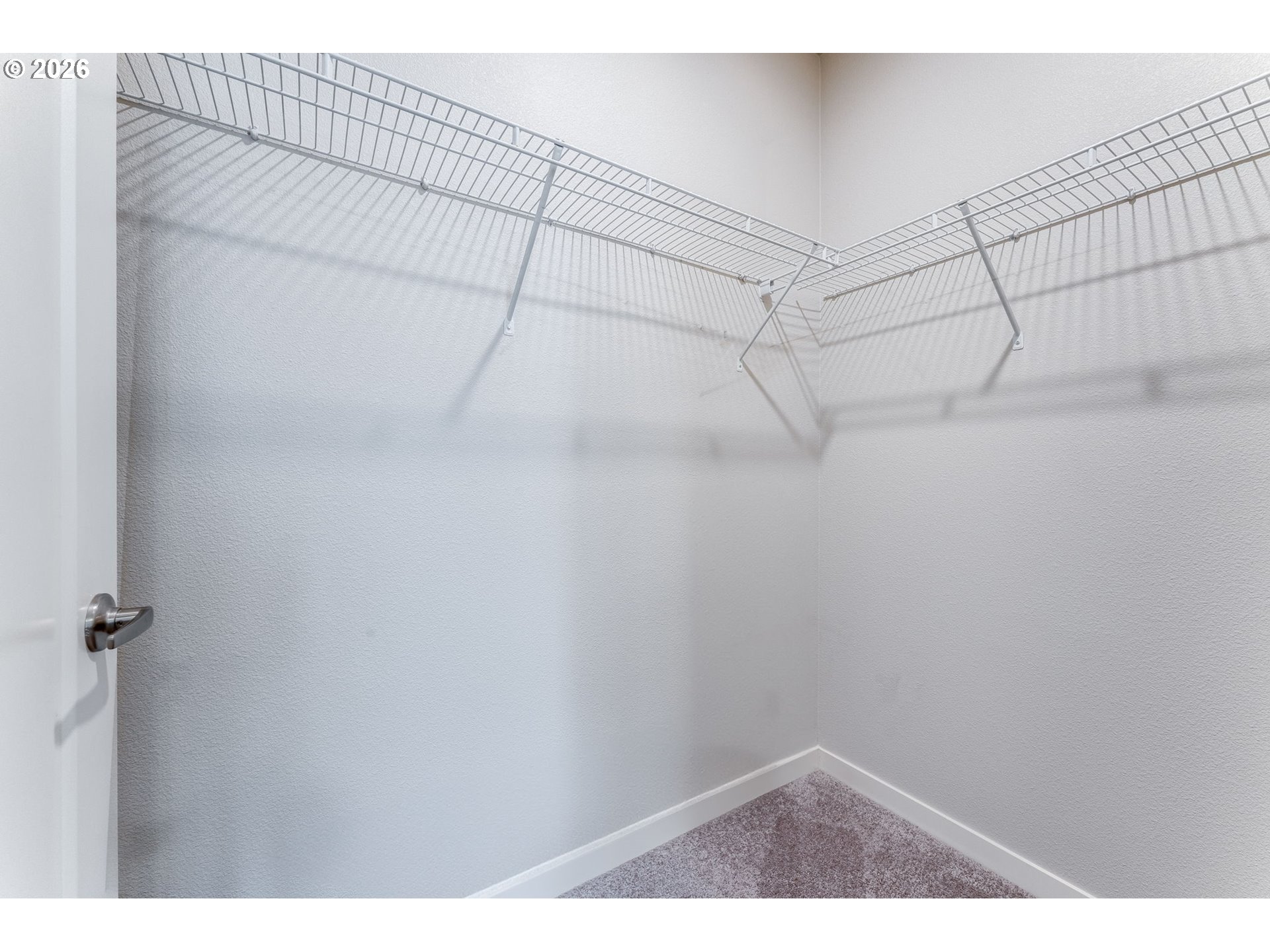 17149 Southwest Snowdale Street, Unit 103 Beaverton, OR 97007 - Photo 28 of 48 a view of a room with racks on the wall