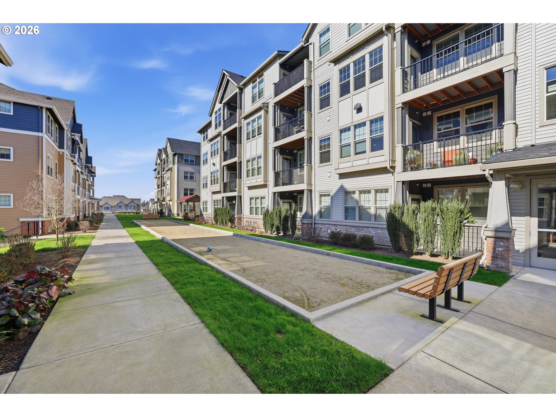 17149 Southwest Snowdale Street, Unit 103 Beaverton, OR 97007 - Photo 3 of 48 a building exterior view with a sitting space
