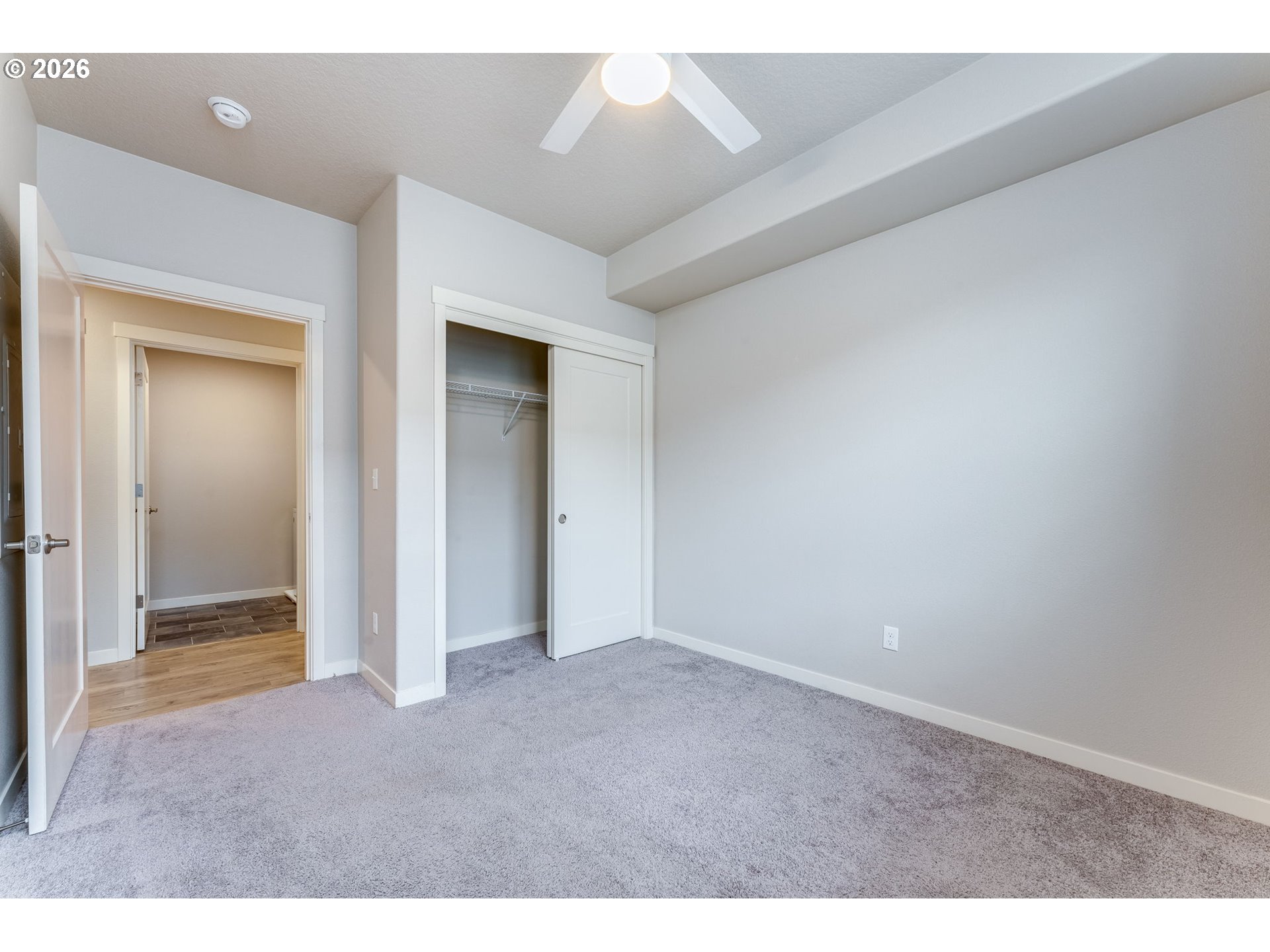 17149 Southwest Snowdale Street, Unit 103 Beaverton, OR 97007 - Photo 32 of 48 a view of an empty room and chandelier fan