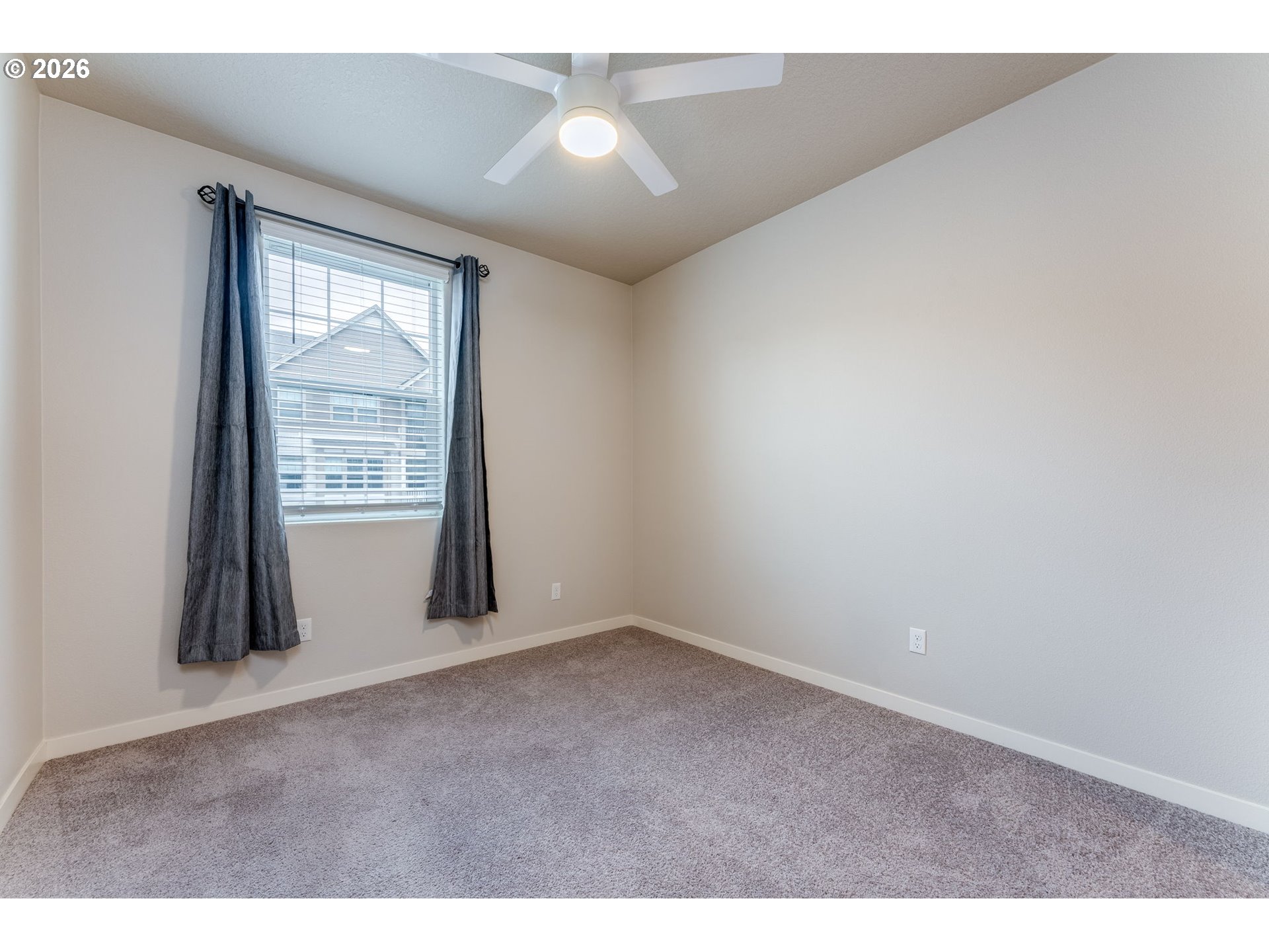17149 Southwest Snowdale Street, Unit 103 Beaverton, OR 97007 - Photo 34 of 48 an empty room with windows and closet