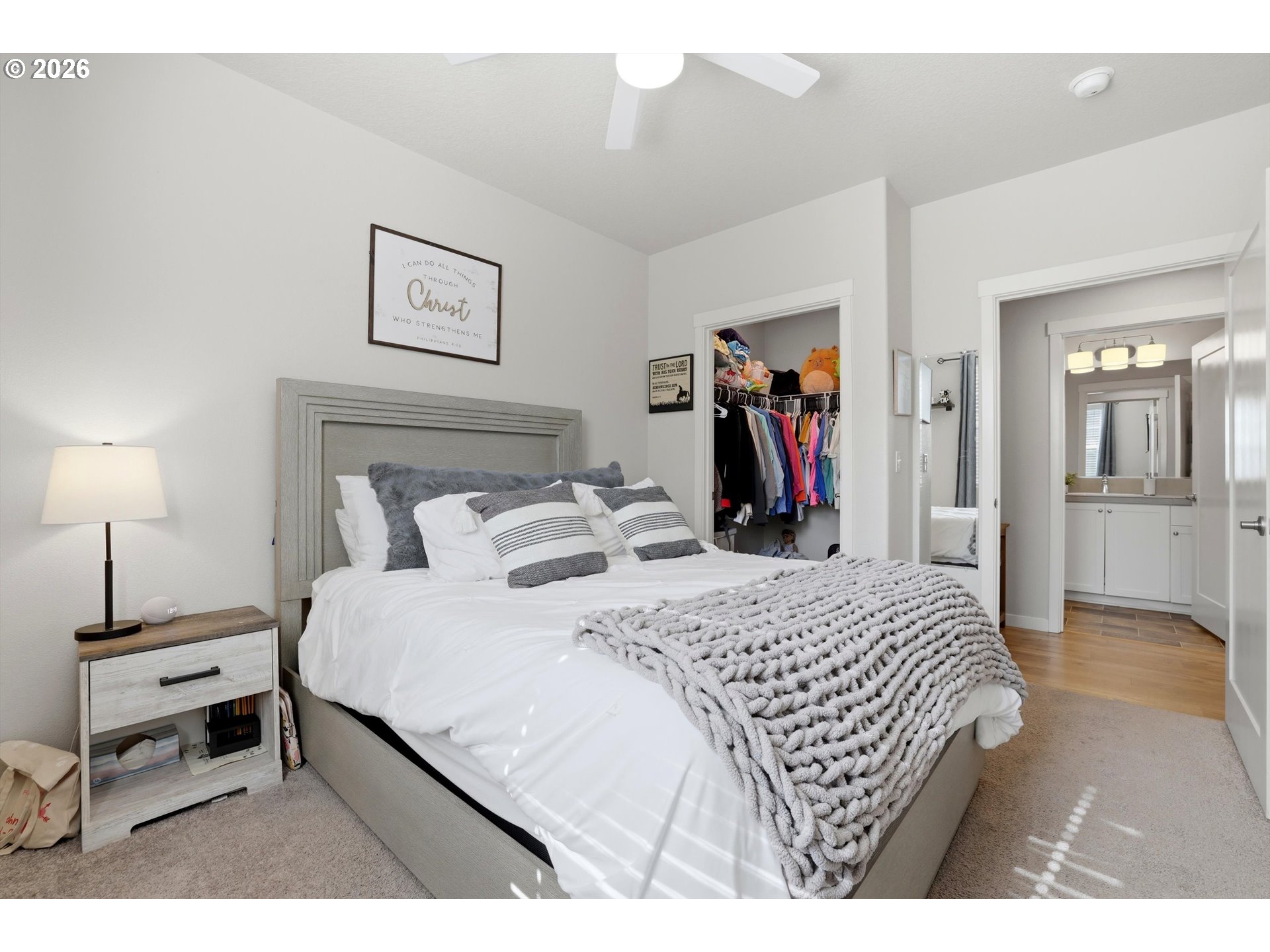 17149 Southwest Snowdale Street, Unit 103 Beaverton, OR 97007 - Photo 35 of 48 a bedroom with a bed and a mirror