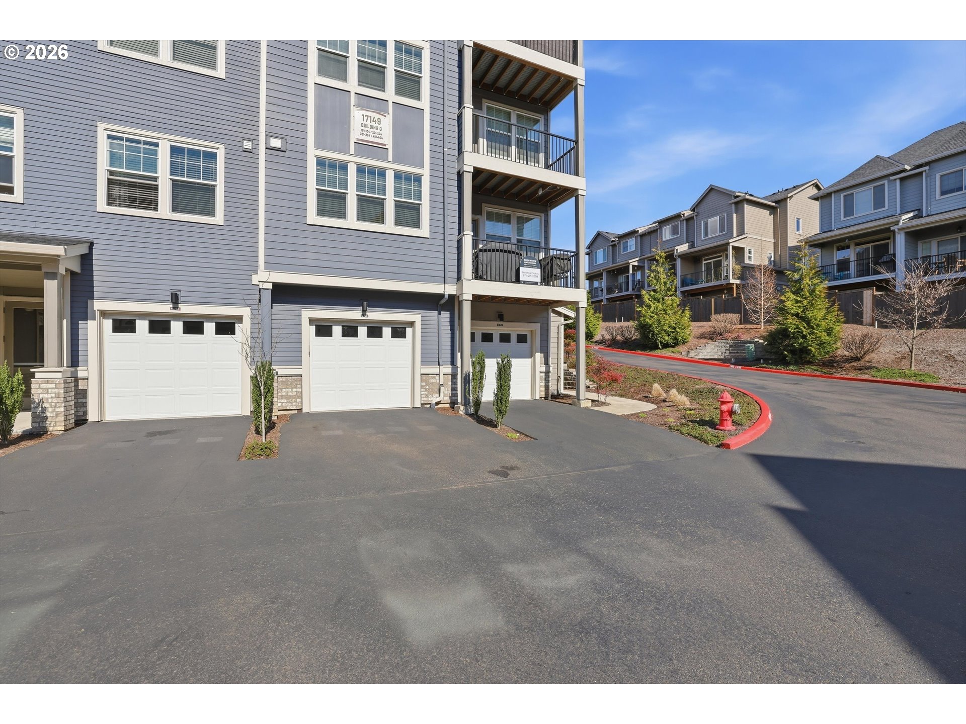 17149 Southwest Snowdale Street, Unit 103 Beaverton, OR 97007 - Photo 39 of 48 a view of a street with buildings