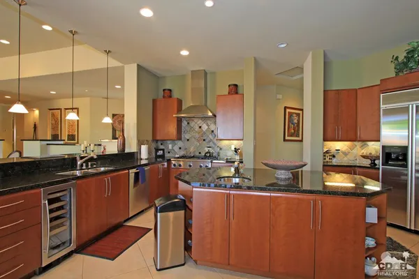 a dining room with furniture and a floor to ceiling window