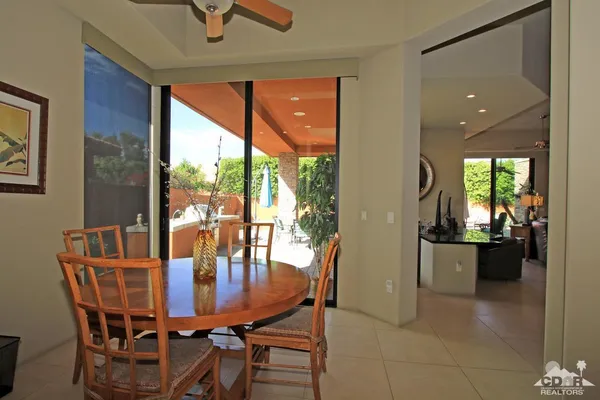 a bedroom with a bed and a mirror