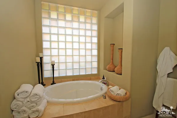 a bathroom with a shower sink and mirror