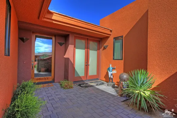 a view of a kitchen with refrigerator and toys