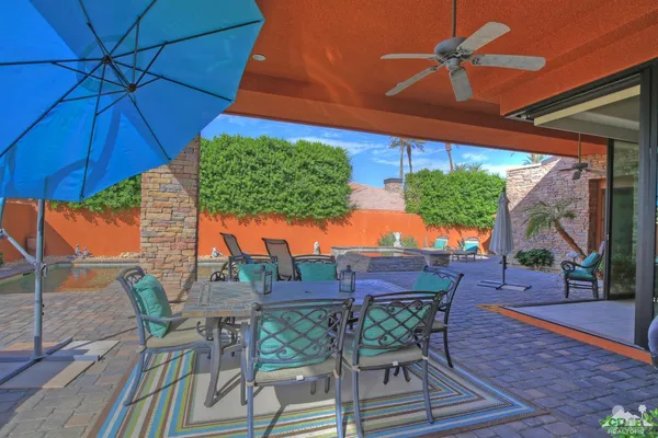 a view of an outdoor sitting area with furniture