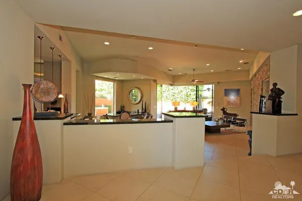 a view of a living room and a large window