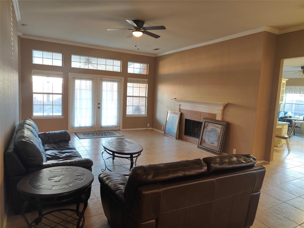 7900 Roaring Ridge Drive Plano, TX 75025 - Photo 15 of 34 a living room with furniture and a fireplace