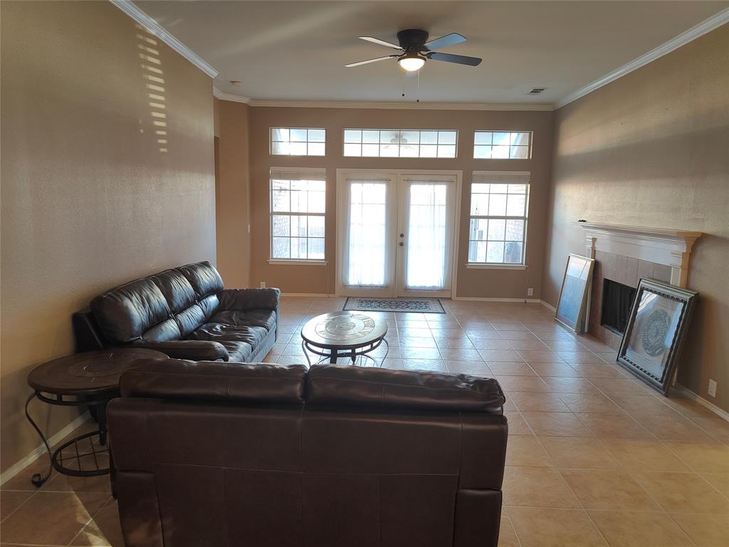 7900 Roaring Ridge Drive Plano, TX 75025 - Photo 16 of 34 a living room with furniture and a fireplace