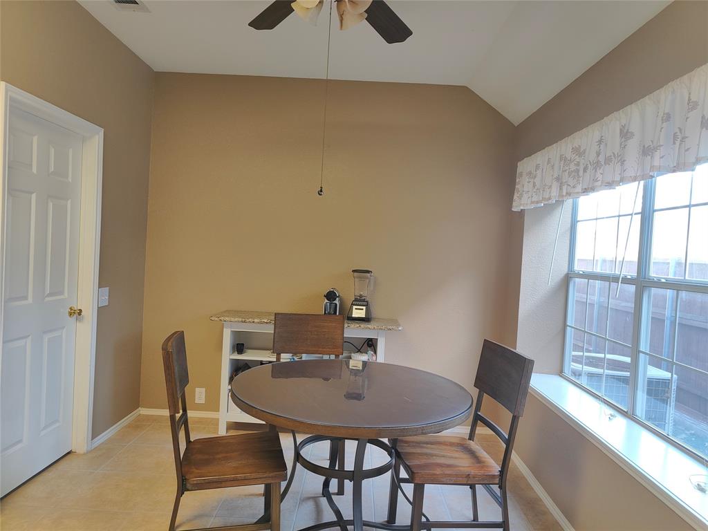 7900 Roaring Ridge Drive Plano, TX 75025 - Photo 19 of 34 a view of a dining room with furniture and window