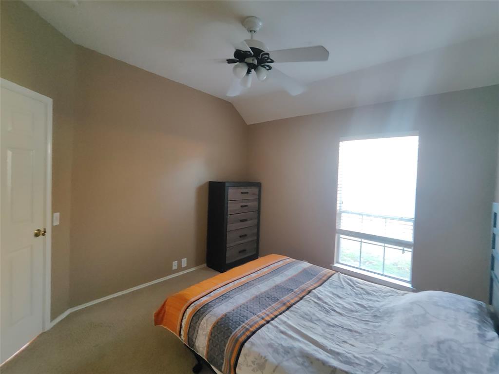 7900 Roaring Ridge Drive Plano, TX 75025 - Photo 29 of 34 a bedroom with a bed and a window