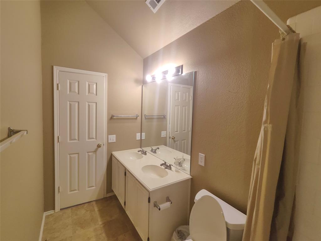 7900 Roaring Ridge Drive Plano, TX 75025 - Photo 31 of 34 a bathroom with a sink a toilet and shower