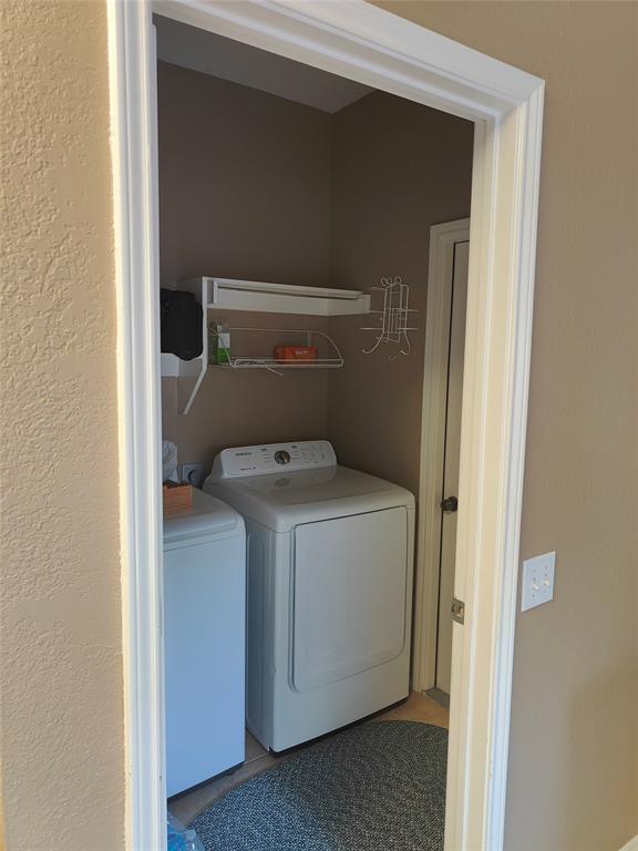 7900 Roaring Ridge Drive Plano, TX 75025 - Photo 32 of 34 a utility room with dryer and washer