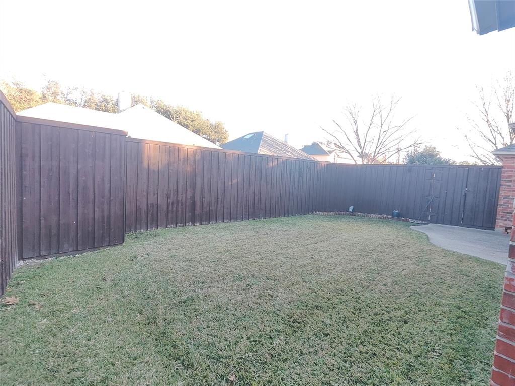 7900 Roaring Ridge Drive Plano, TX 75025 - Photo 33 of 34 a view of outdoor space with wooden fence