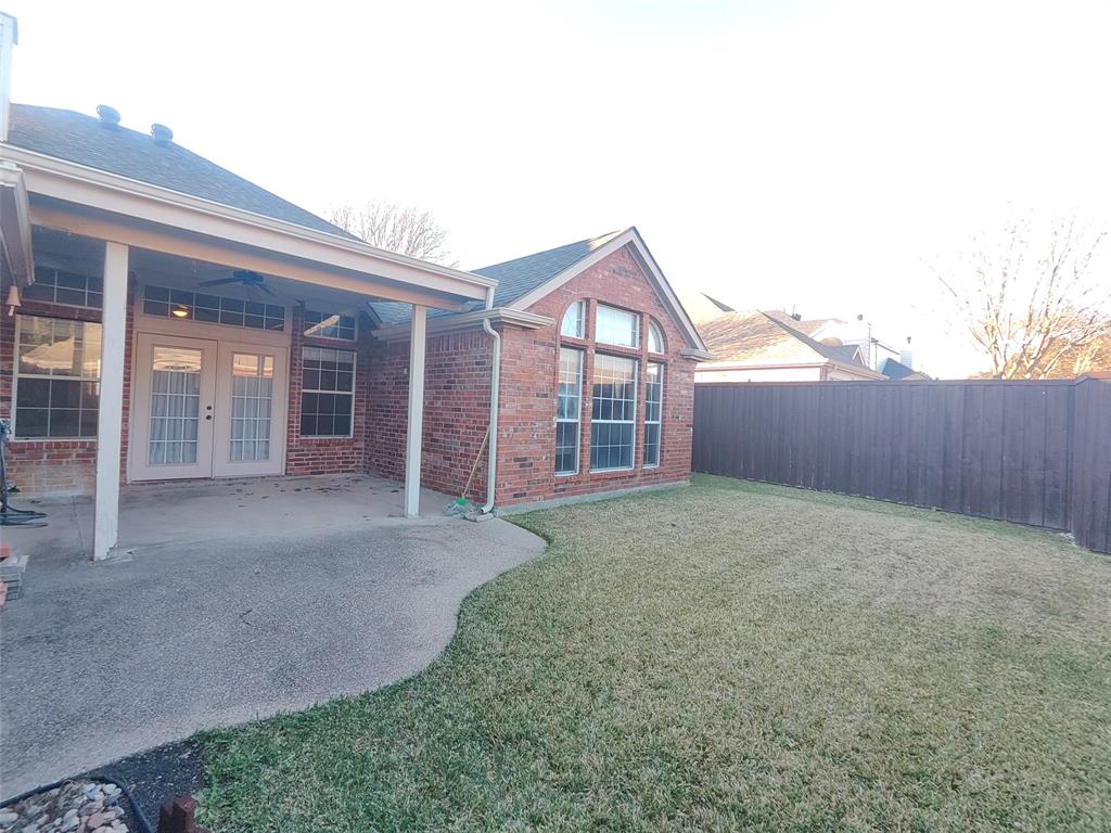 7900 Roaring Ridge Drive Plano, TX 75025 - Photo 34 of 34 front view of a house with a yard