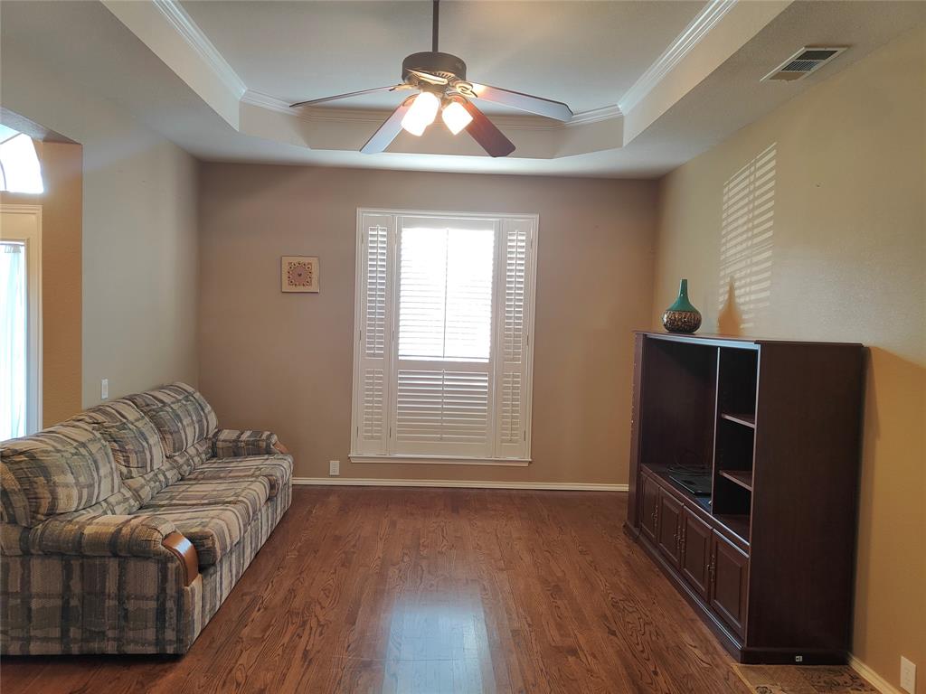 7900 Roaring Ridge Drive Plano, TX 75025 - Photo 4 of 34 a living room with furniture and a flat screen tv
