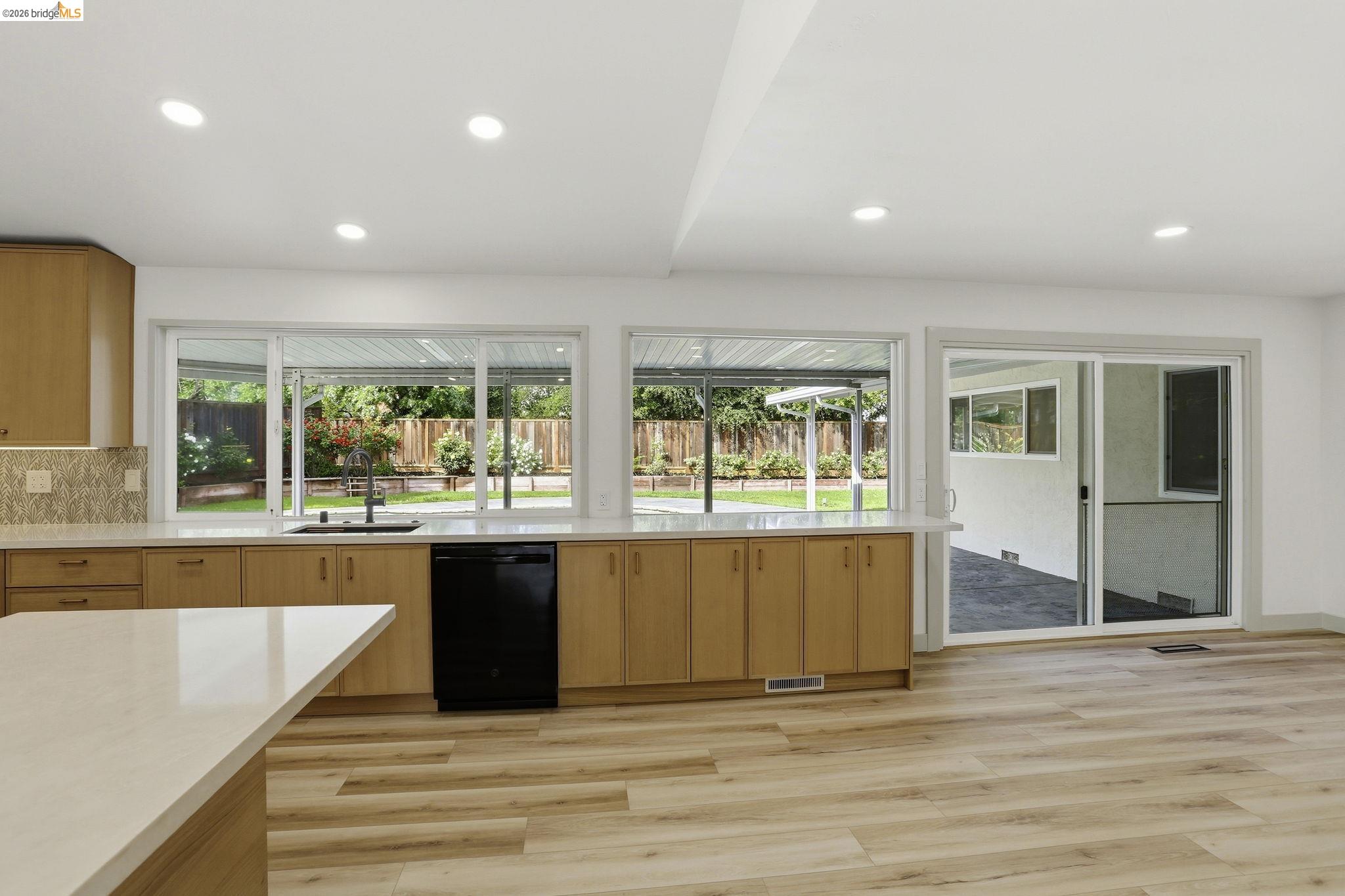 2438 Merritt Place Livermore, CA 94550 - Photo 17 of 64 a large space with wooden floor and window