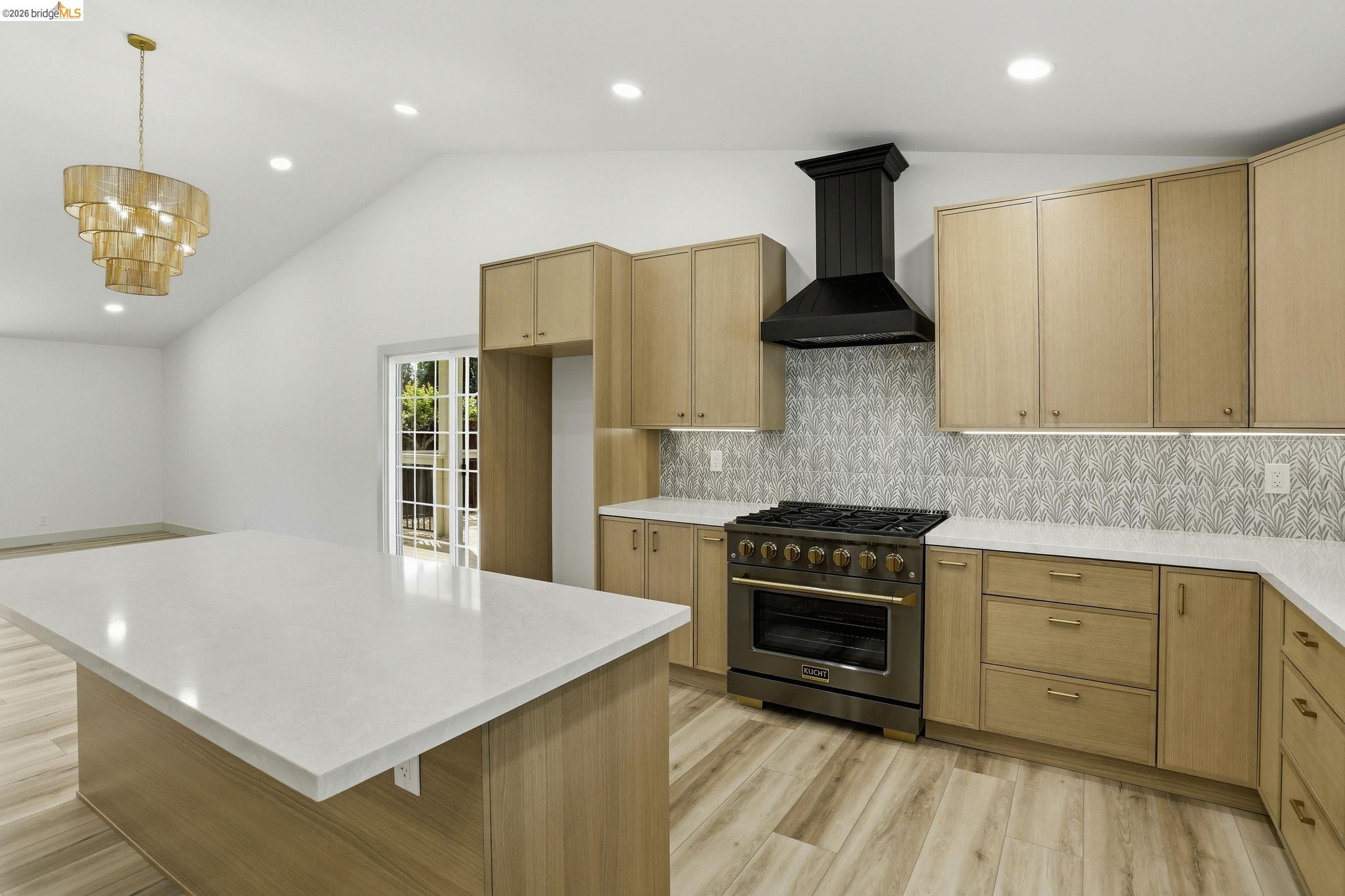 2438 Merritt Place Livermore, CA 94550 - Photo 19 of 64 a kitchen with stainless steel appliances granite countertop a stove a refrigerator a sink dishwasher with a dining table and chairs