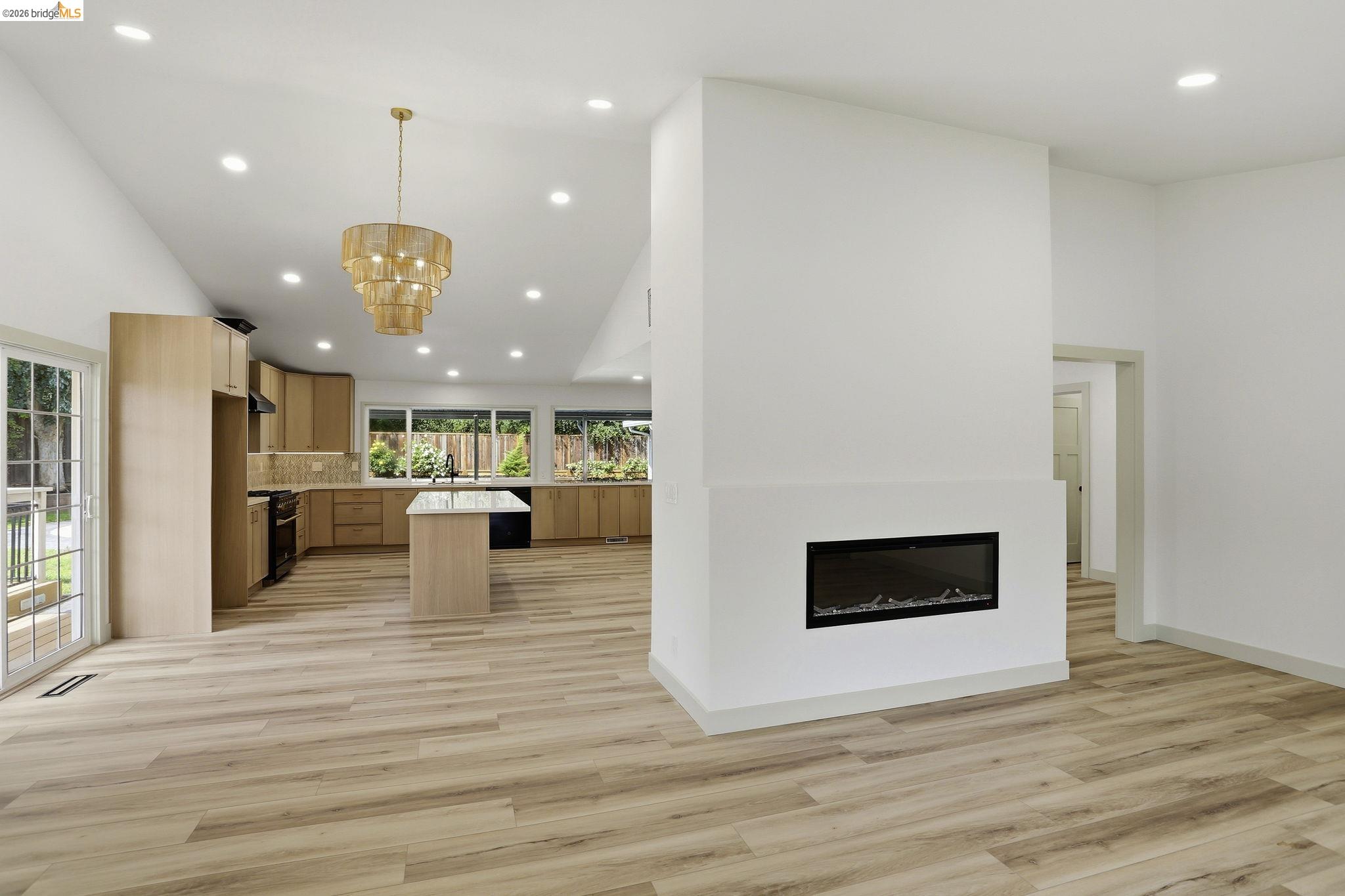 2438 Merritt Place Livermore, CA 94550 - Photo 22 of 64 a view of a living room and kitchen with flat screen tv
