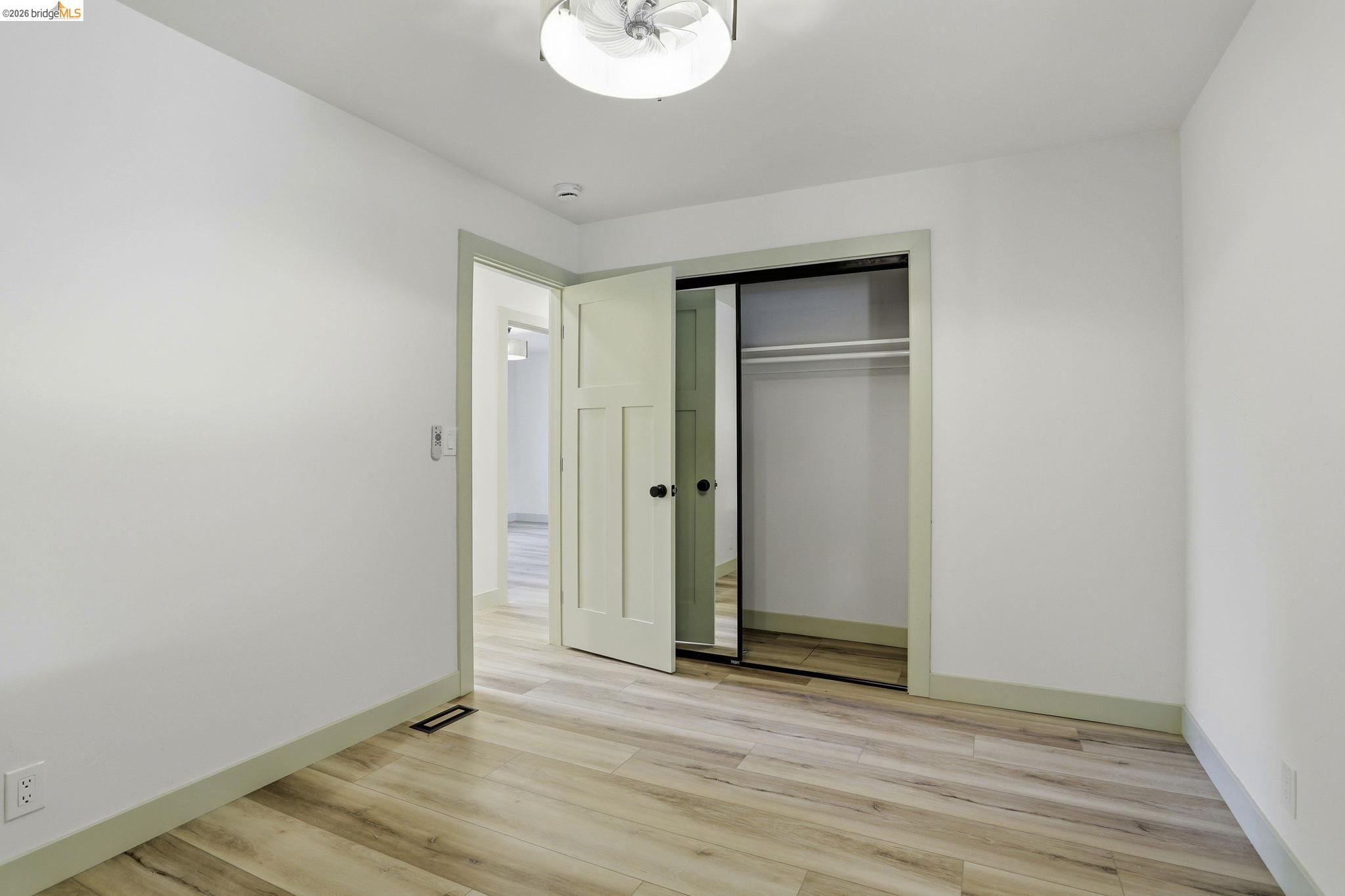 2438 Merritt Place Livermore, CA 94550 - Photo 26 of 64 a view of an empty room with wooden floor and a window