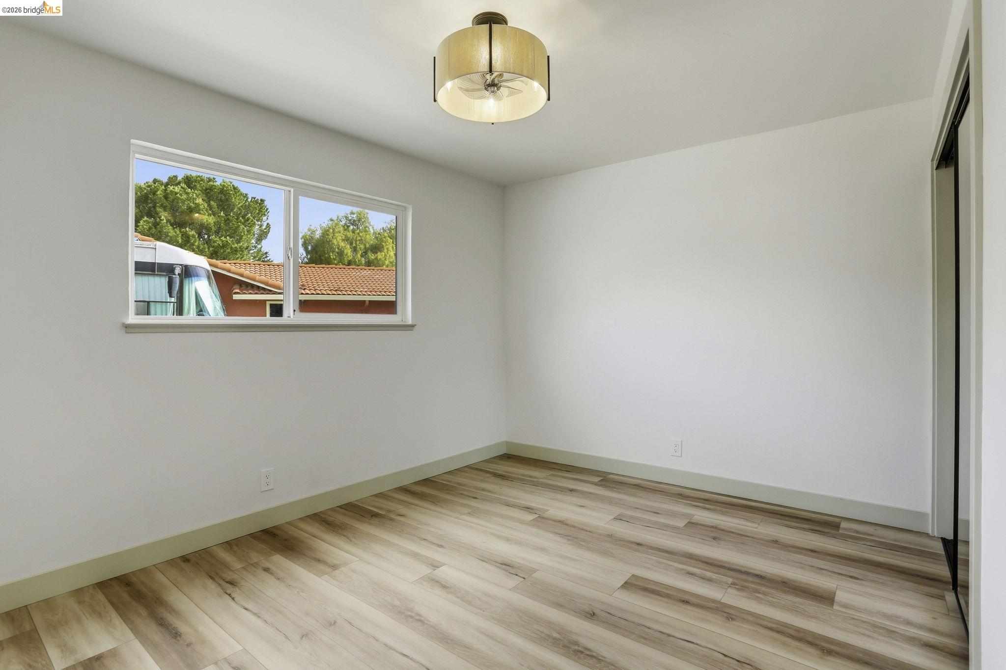 2438 Merritt Place Livermore, CA 94550 - Photo 28 of 64 Unfurnished room with light wood finished floors and ceiling fan