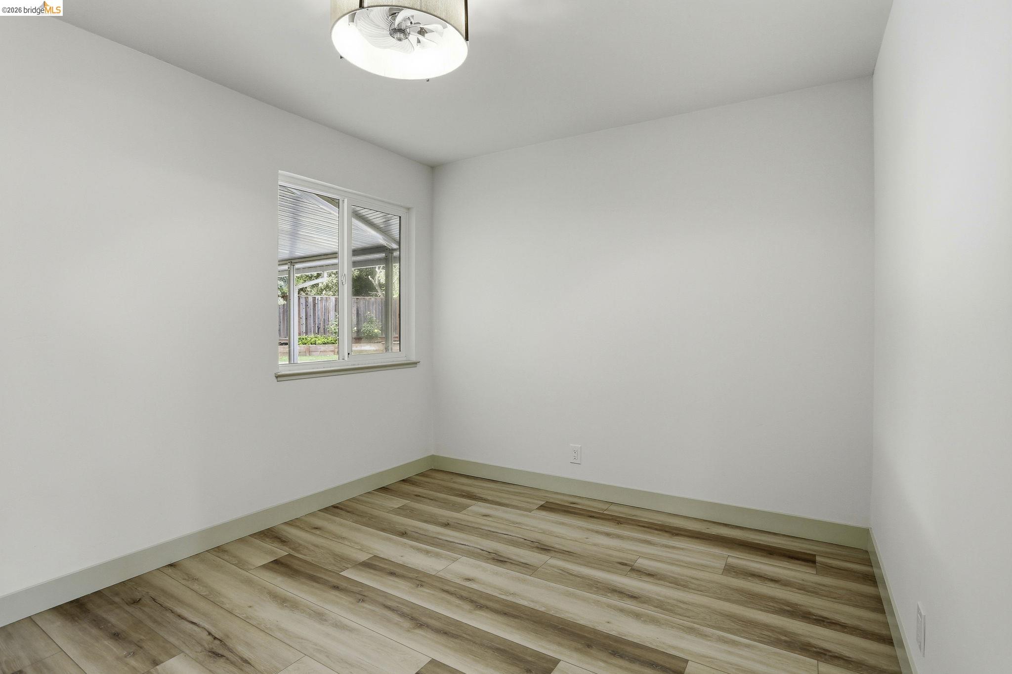 2438 Merritt Place Livermore, CA 94550 - Photo 30 of 64 a view of a room with wooden floor and a window