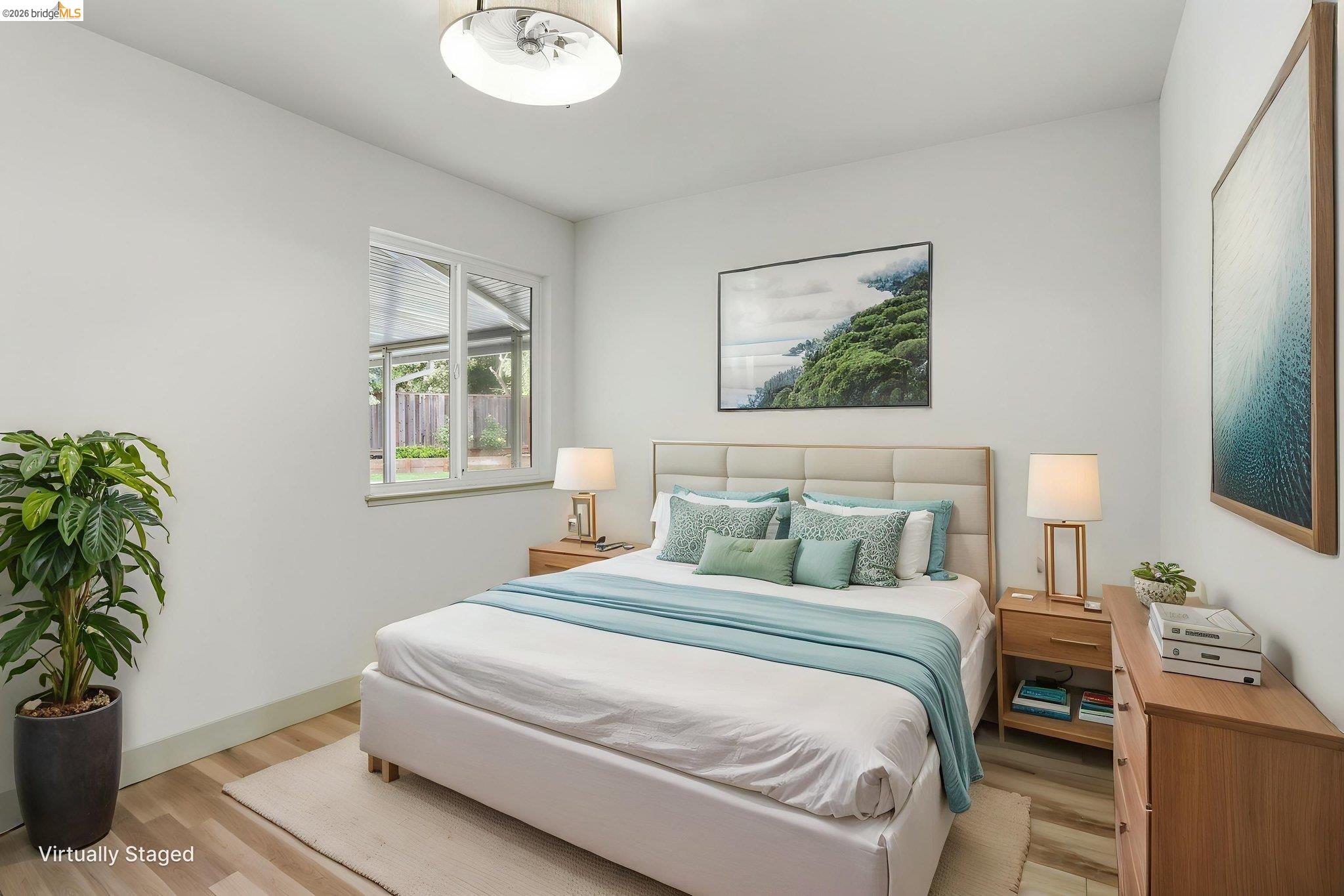 2438 Merritt Place Livermore, CA 94550 - Photo 31 of 64 a bedroom with a bed and a potted plant