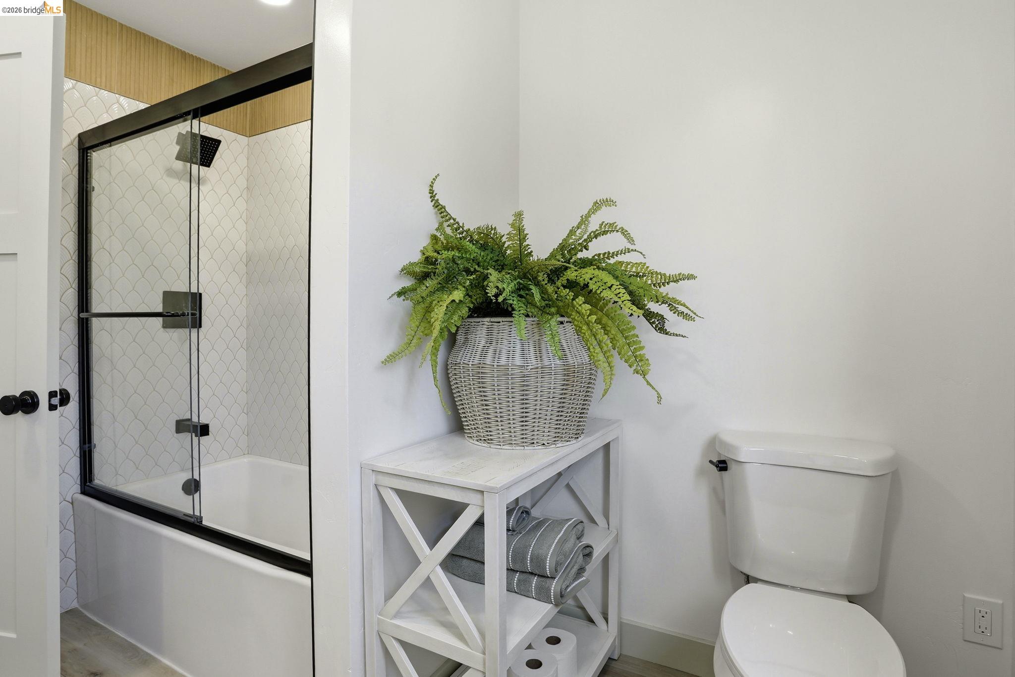 2438 Merritt Place Livermore, CA 94550 - Photo 39 of 64 a bathroom with a toilet a sink and shower
