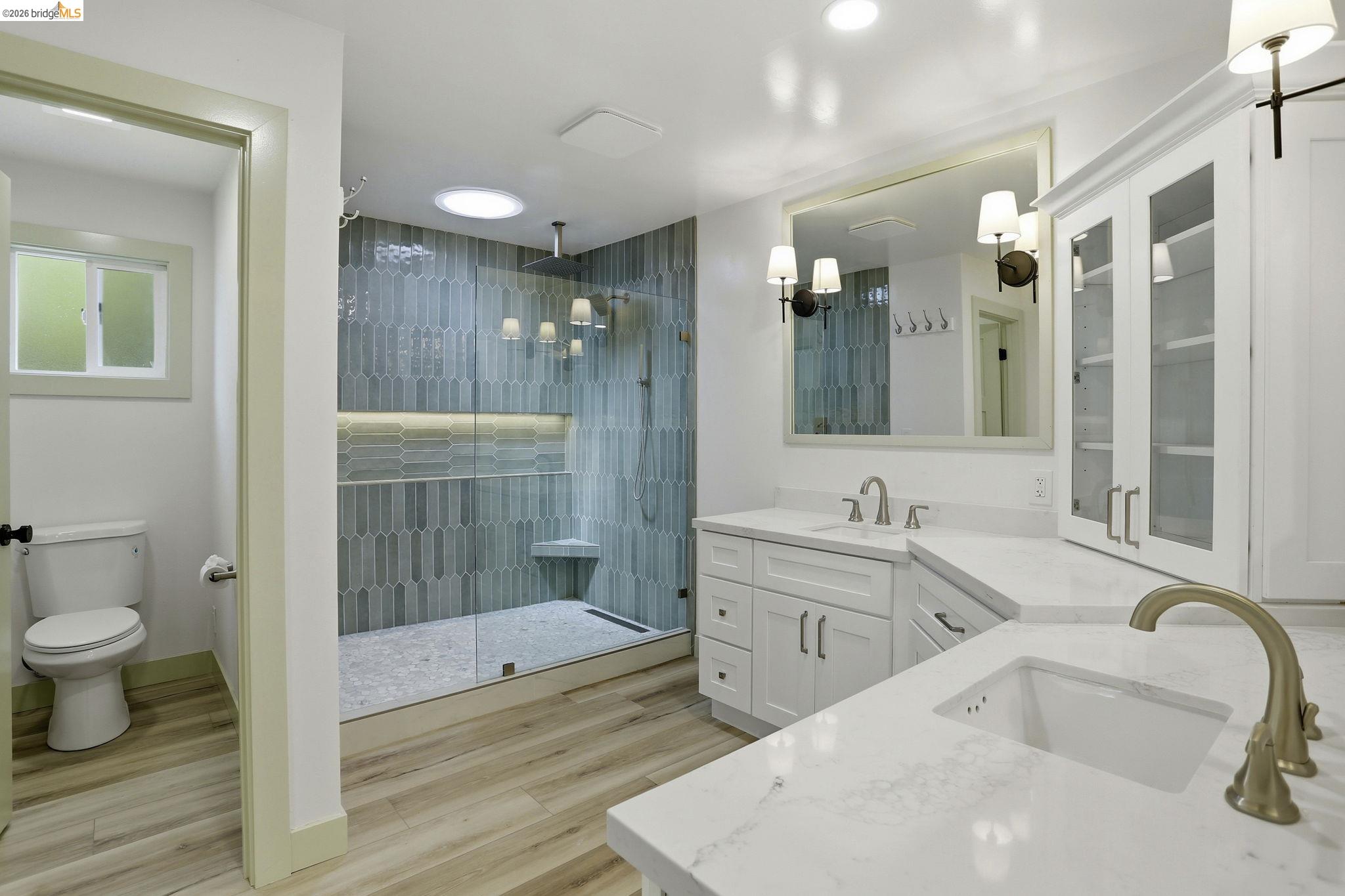 2438 Merritt Place Livermore, CA 94550 - Photo 41 of 64 Full bathroom with double vanity, light wood-style floors, and a stall shower
