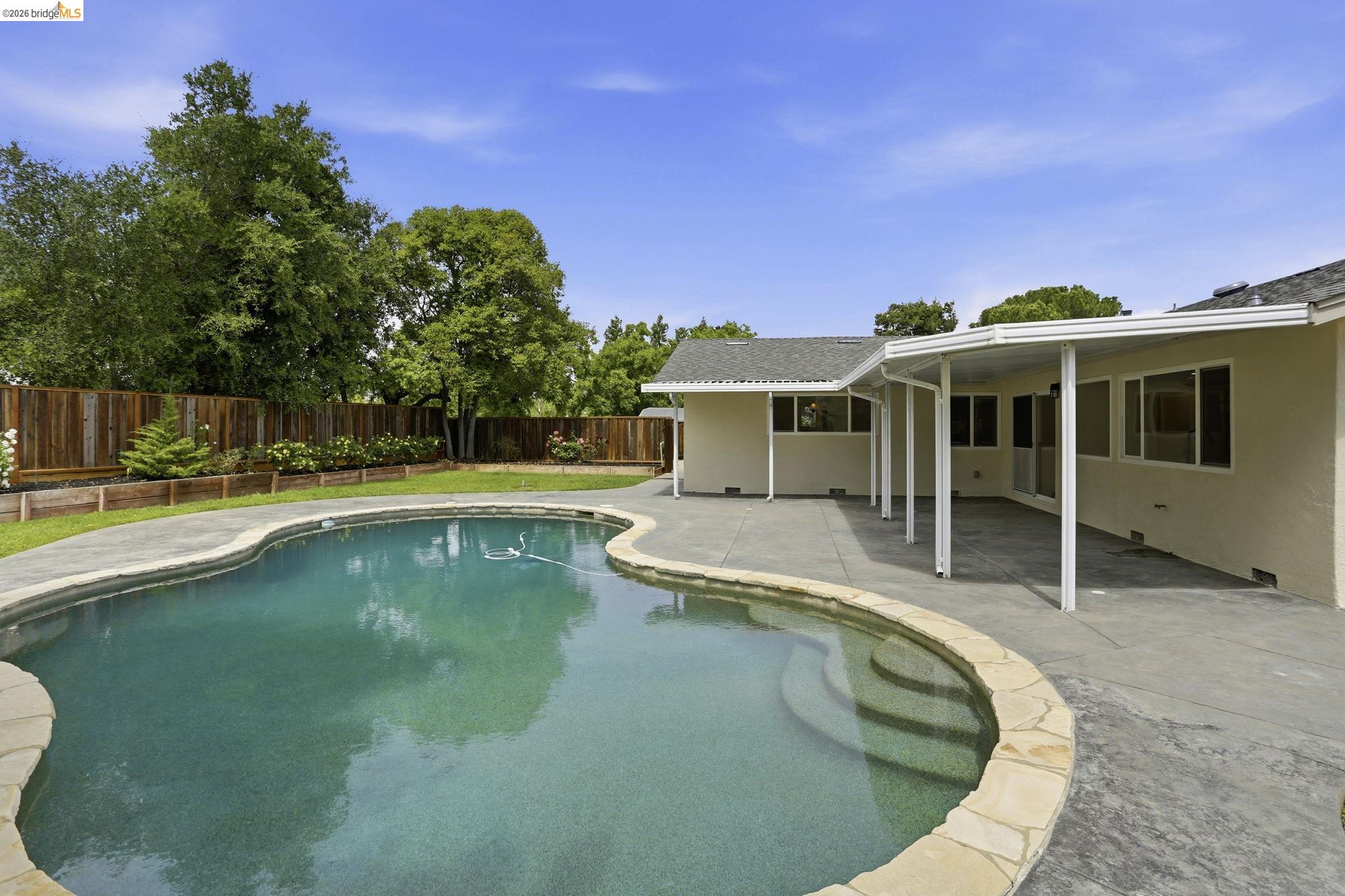 2438 Merritt Place Livermore, CA 94550 - Photo 50 of 64 a view of a house with swimming pool