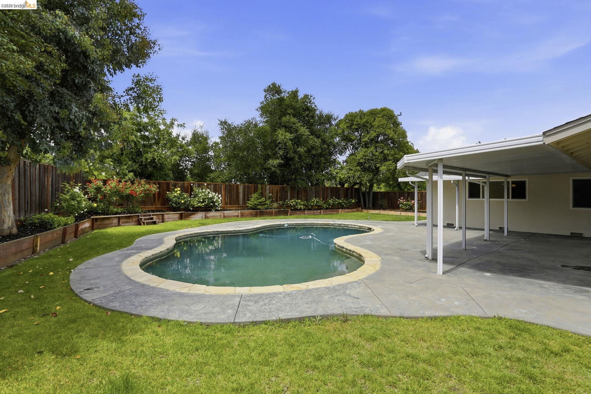 2438 Merritt Place Livermore, CA 94550 - Photo 51 of 64 a view of a house with swimming pool and a yard